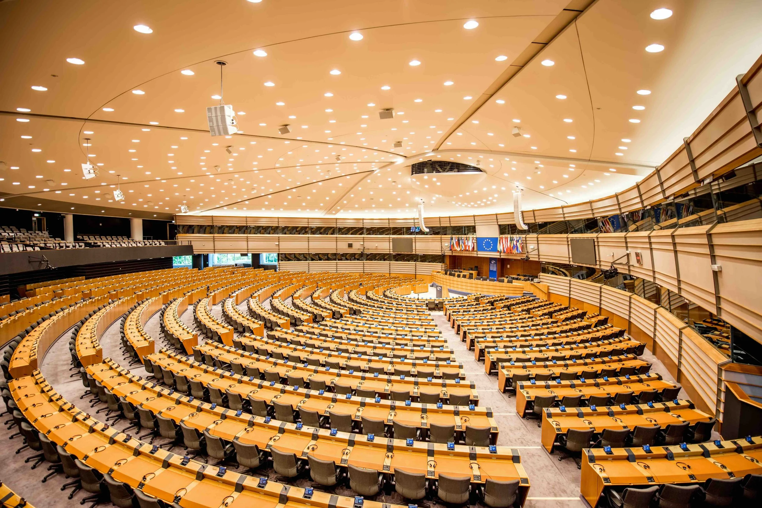 Days 3–4, Brussels | Interior of the European Parliament's hemicycle (plenary chamber) in Brussels — directly illustrates the European Quarter tour and EU legislation role play at the Parlamentarium.
