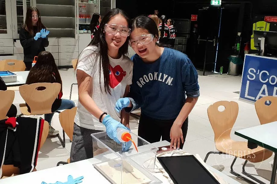 A pair of dedicated students participating in a hands on workshop at CERN