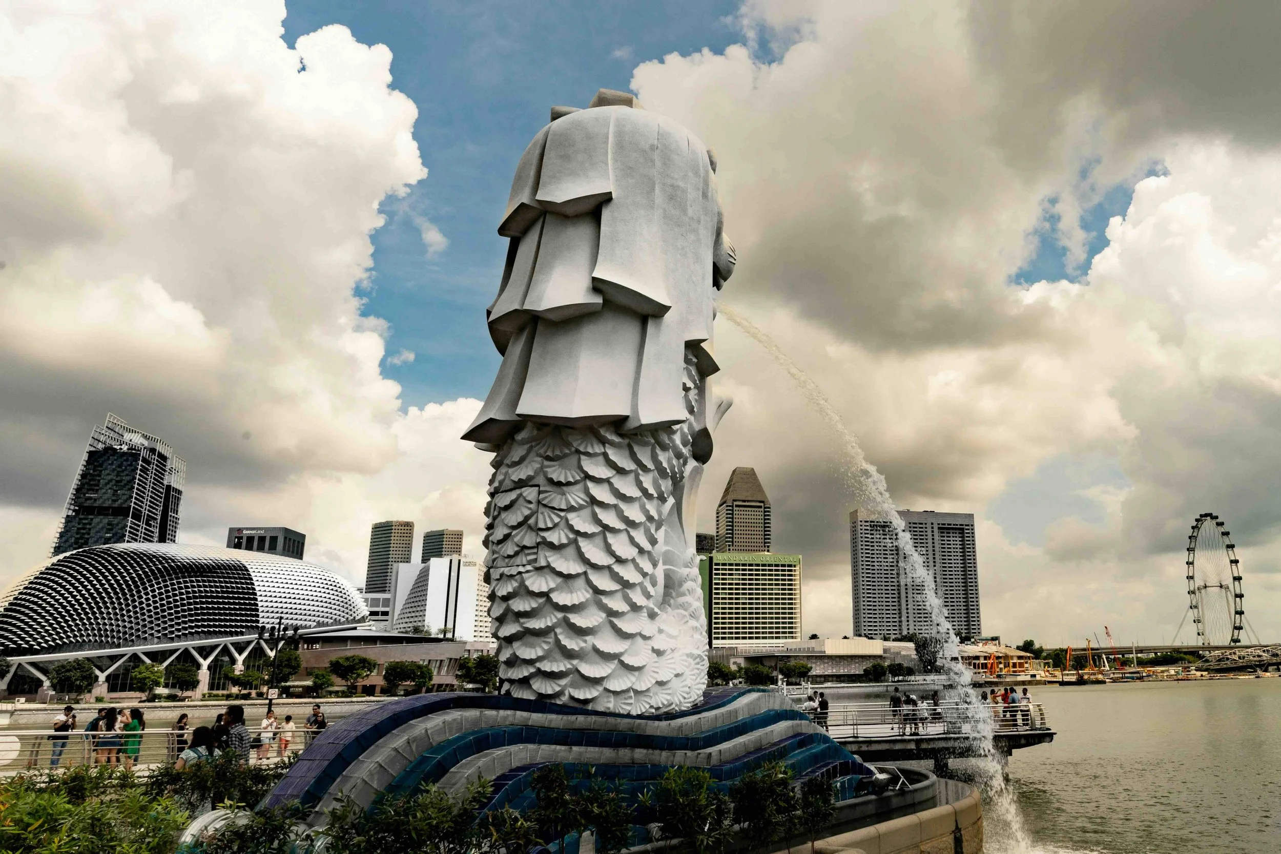 Singapore's iconic Merlion, with the Esplanade and Marina Bay skyline beyond — the postcard moment every student tour needs.
