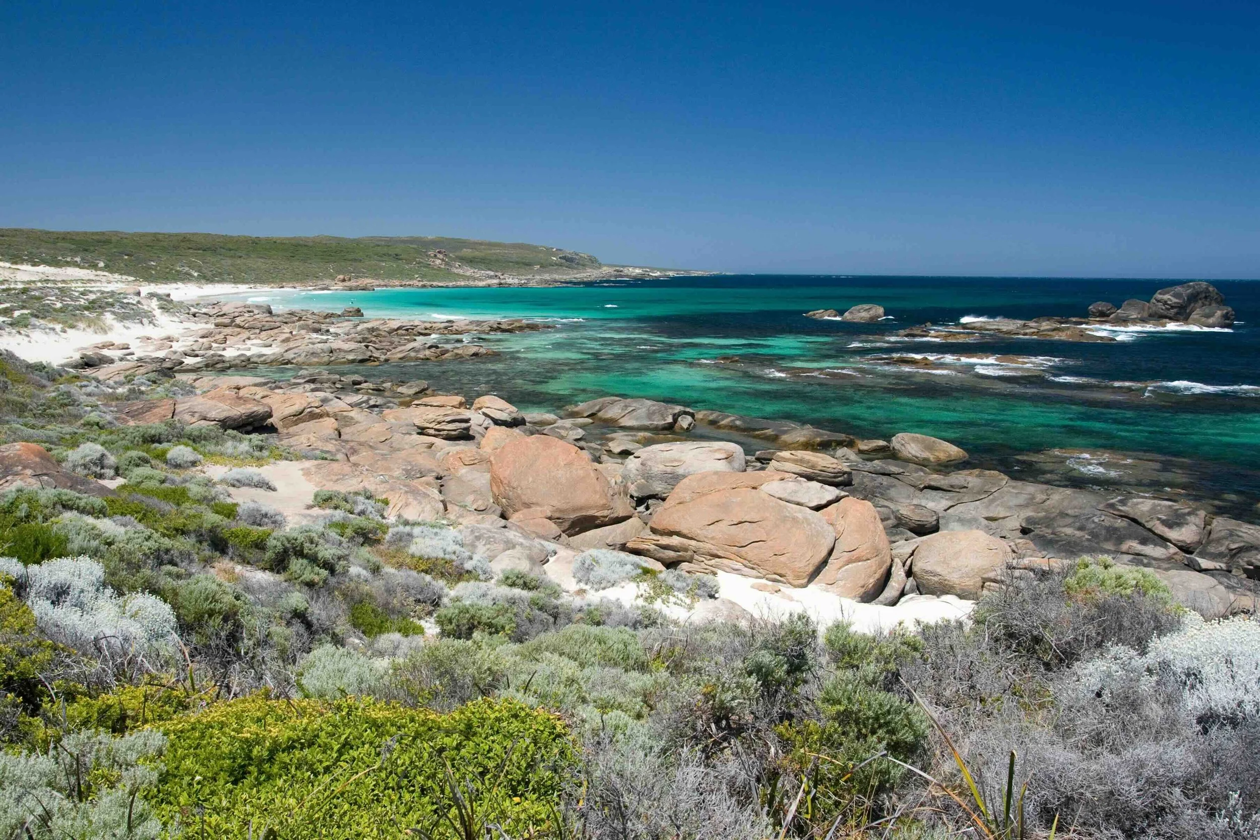 Turquoise waters and granite boulders along the pristine Western Australian coastline near Margaret River — a marine science and geography highlight on Libertas Travel's WA high school excursions.