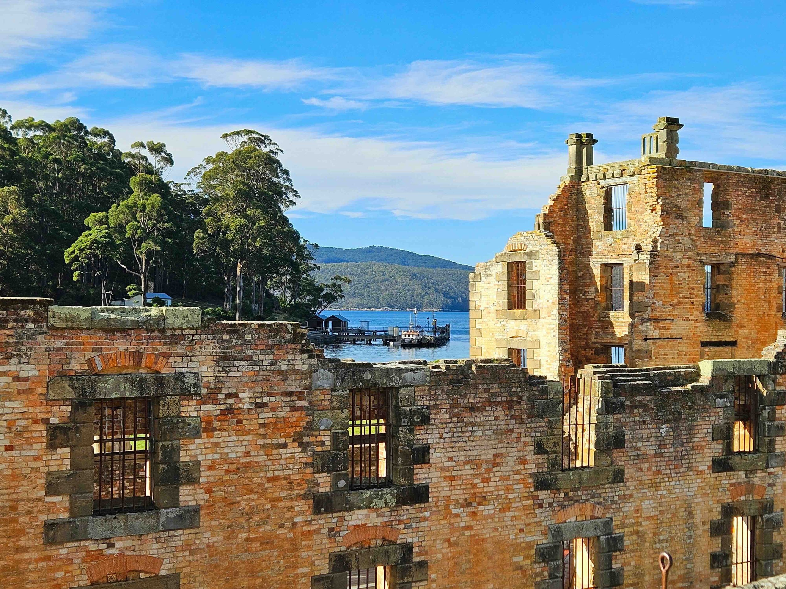 The ruins of the penitentiary at Port Arthur Historic Site, Tasmania, with Carnarvon Bay beyond — a UNESCO World Heritage convict settlement at the heart of Libertas Travel's Tasmania high school excursion.