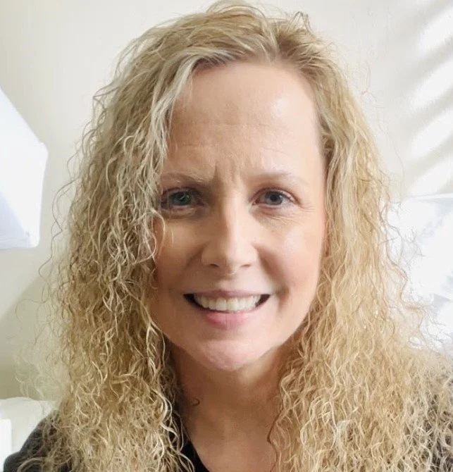 Image of Lori McGruder smiling.  Headshot.