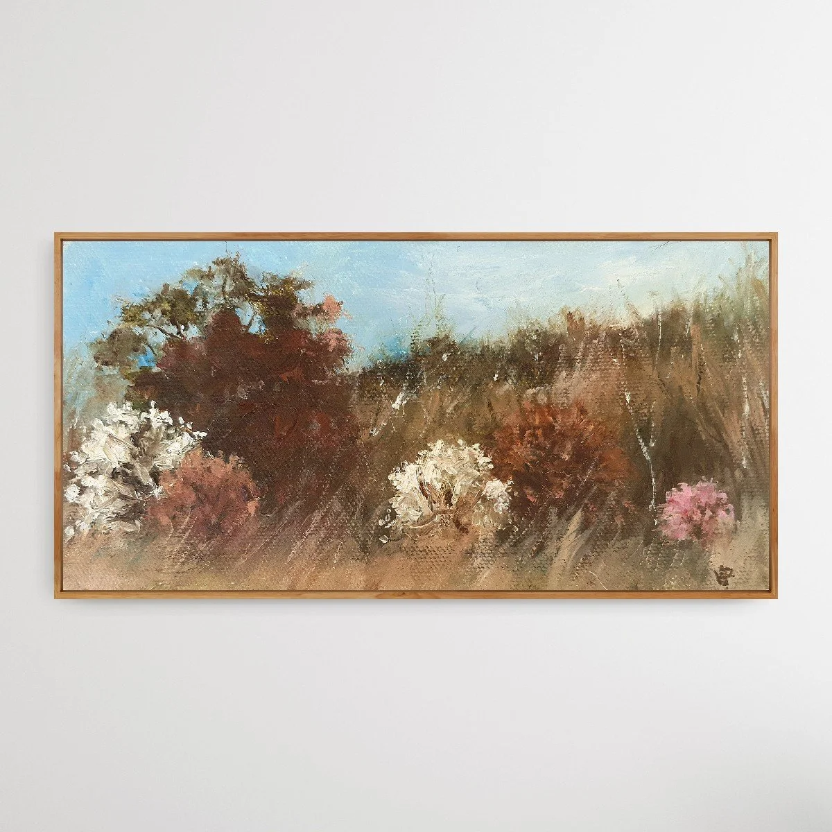 Soft abstract landscape in natural earth tones of light brown and white with cherry blossom.