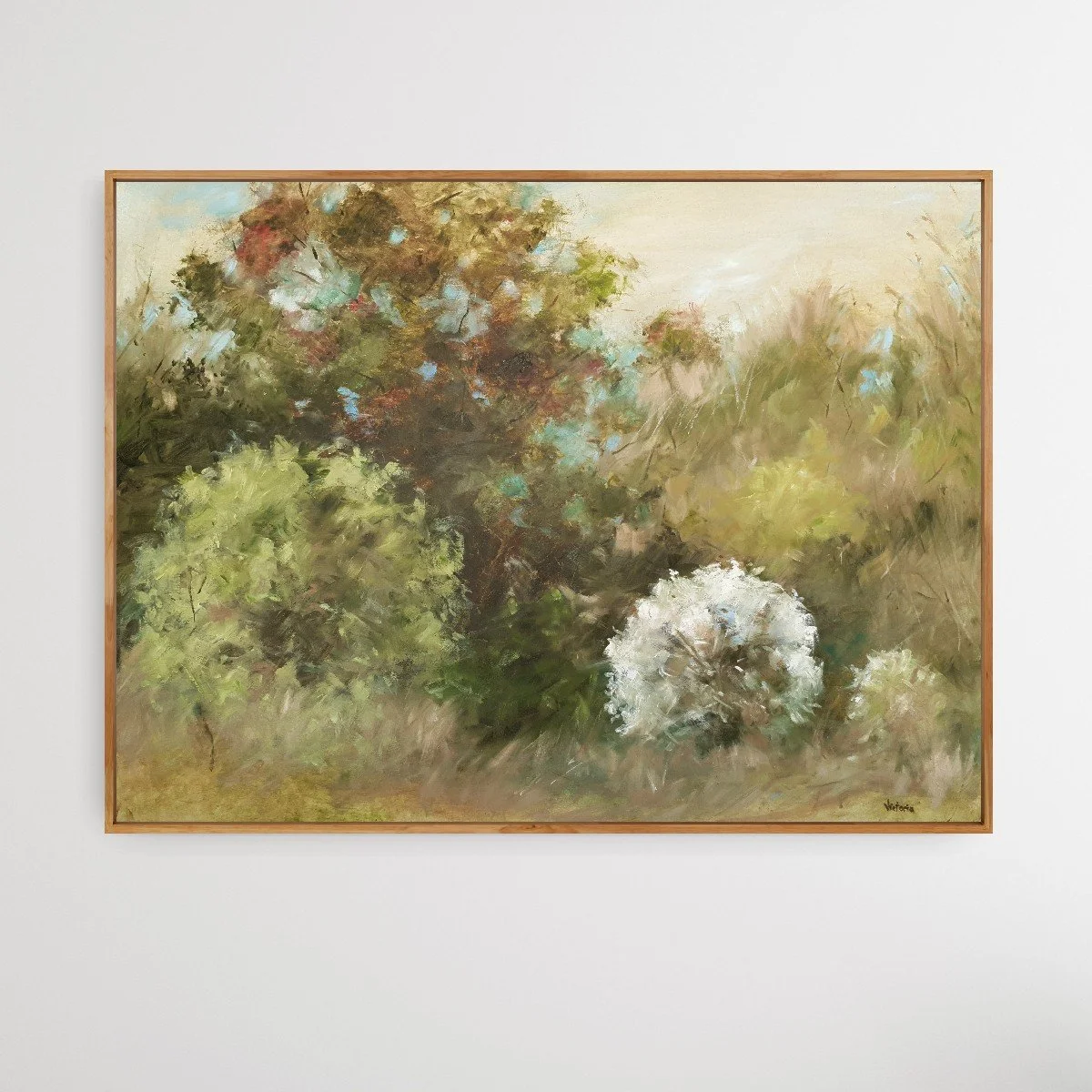 Soft abstract landscape in natural earth tones of green and neutral tones with white cherry blossom.