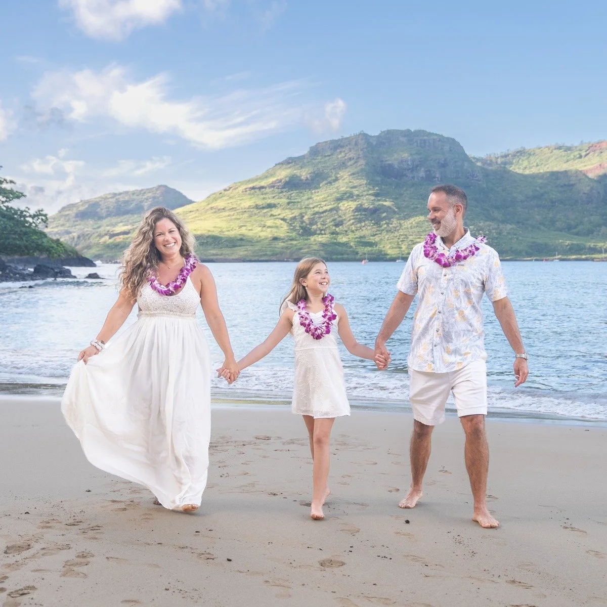Family photos with leis at Kalapaki Beach, Kauai