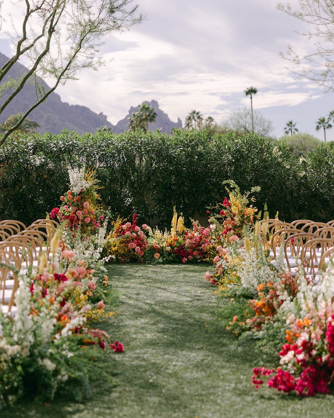 A ceremony framed in color! 🌈

Planning and Design: @chererosalieweddings
Photography: @sarabishop.co
Video: @got.hitched
Venues: @andazscottsdale
Florals: @floralsbykendra
Rentals &amp; Decor: @brighteventrentals @theconfettistudio @bbjlatavola @ce