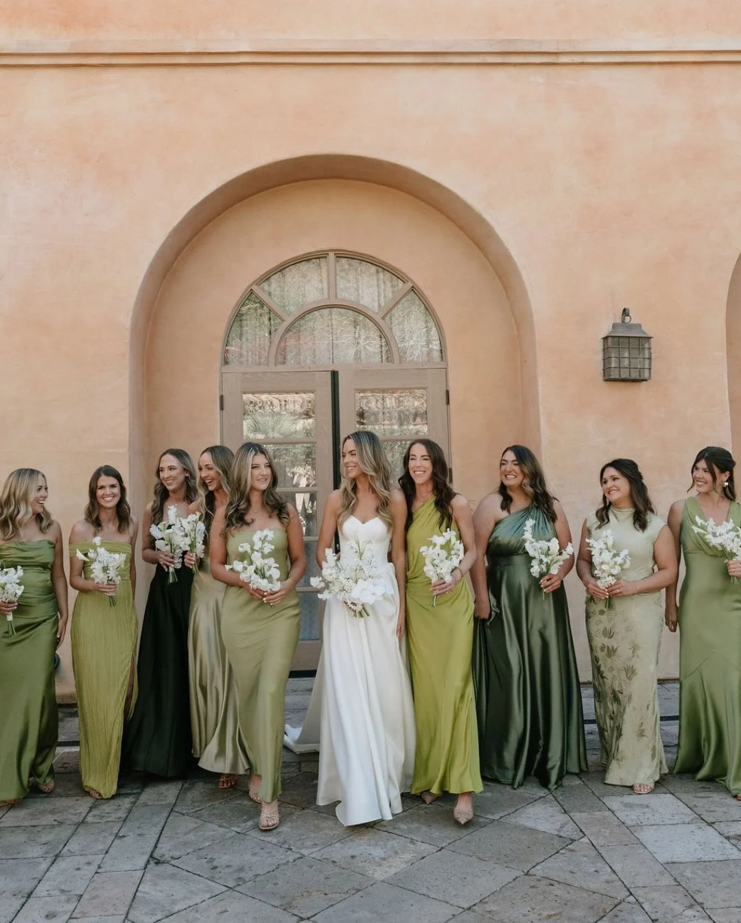 A moment for the bridesmaids! Different shades of green paired with all white bouquets made the perfect combination for this soft, elevated wedding palette.

Venue: @royalpalmsweddings
Planning: @revelweddingcompany
Florals: @floralsbykendra
Photo: @