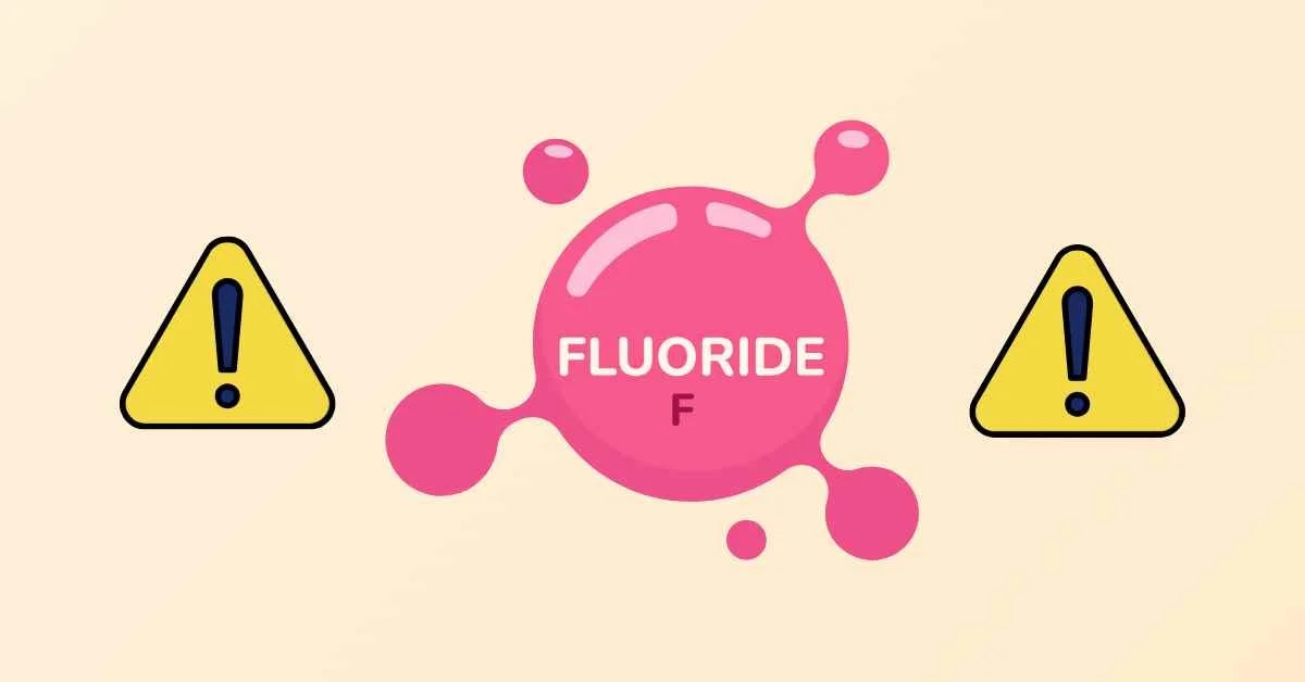 A graphic of a fluoride molecule with warning triangles on either side