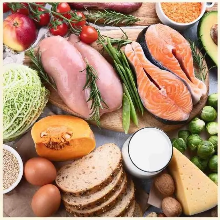 Mediterranean foods: salmon, chicken cheese, wholegrain bread, seeds, nuts, fruit and vegetables