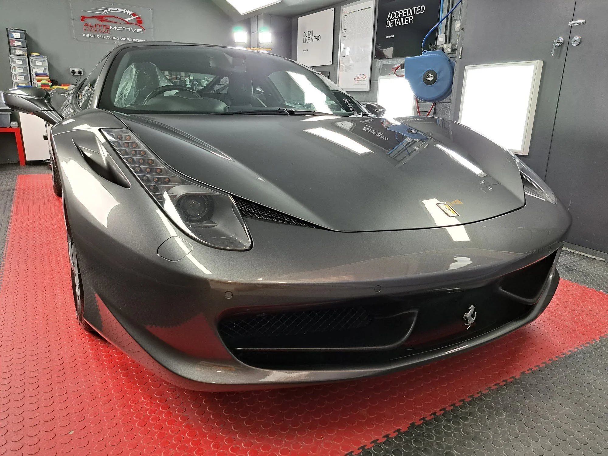 Grey Ferrari 458, front three-quarter view