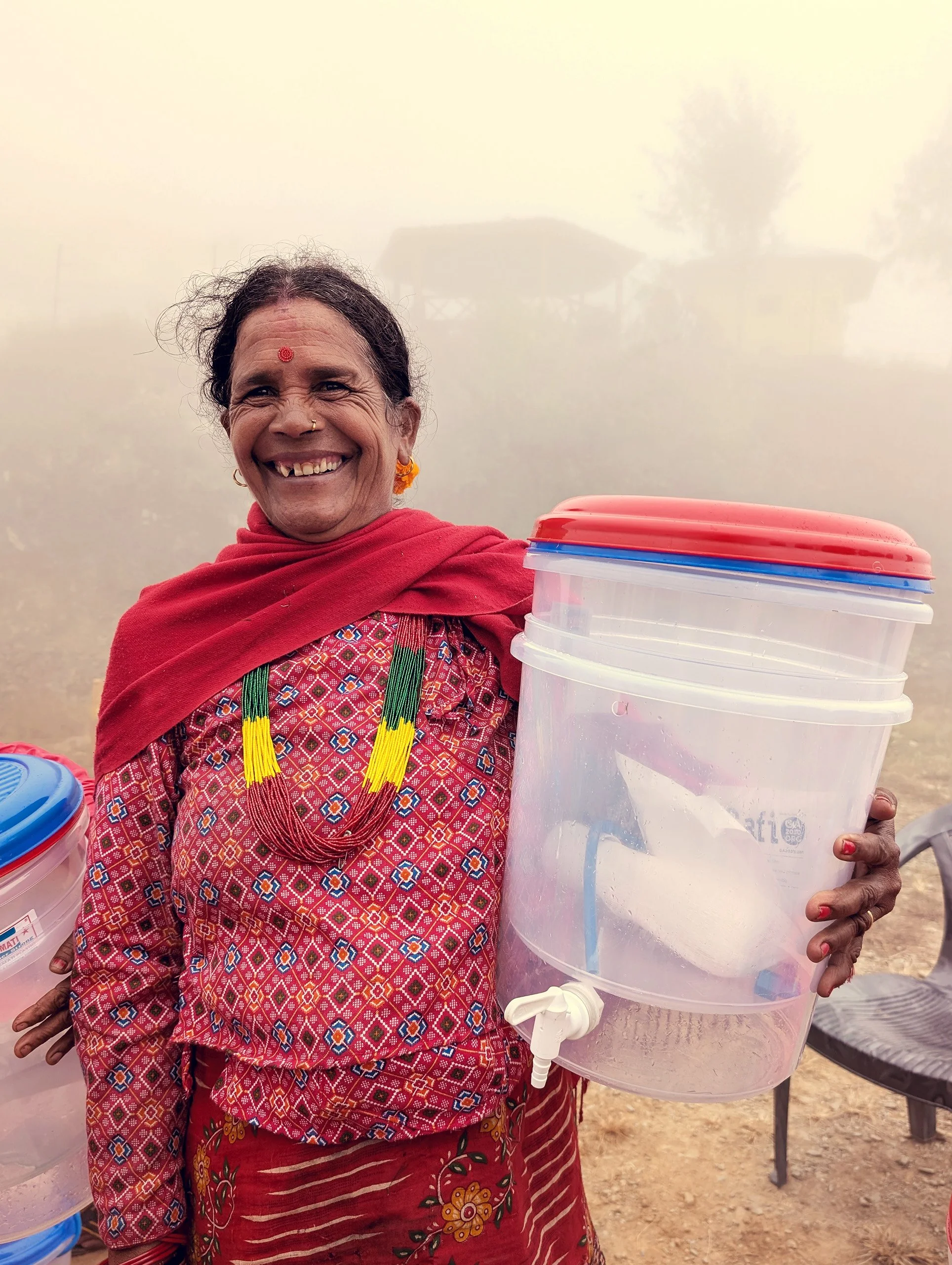 MightyWater_Nepal2024_WomanWithSystem_RobMiller.jpg