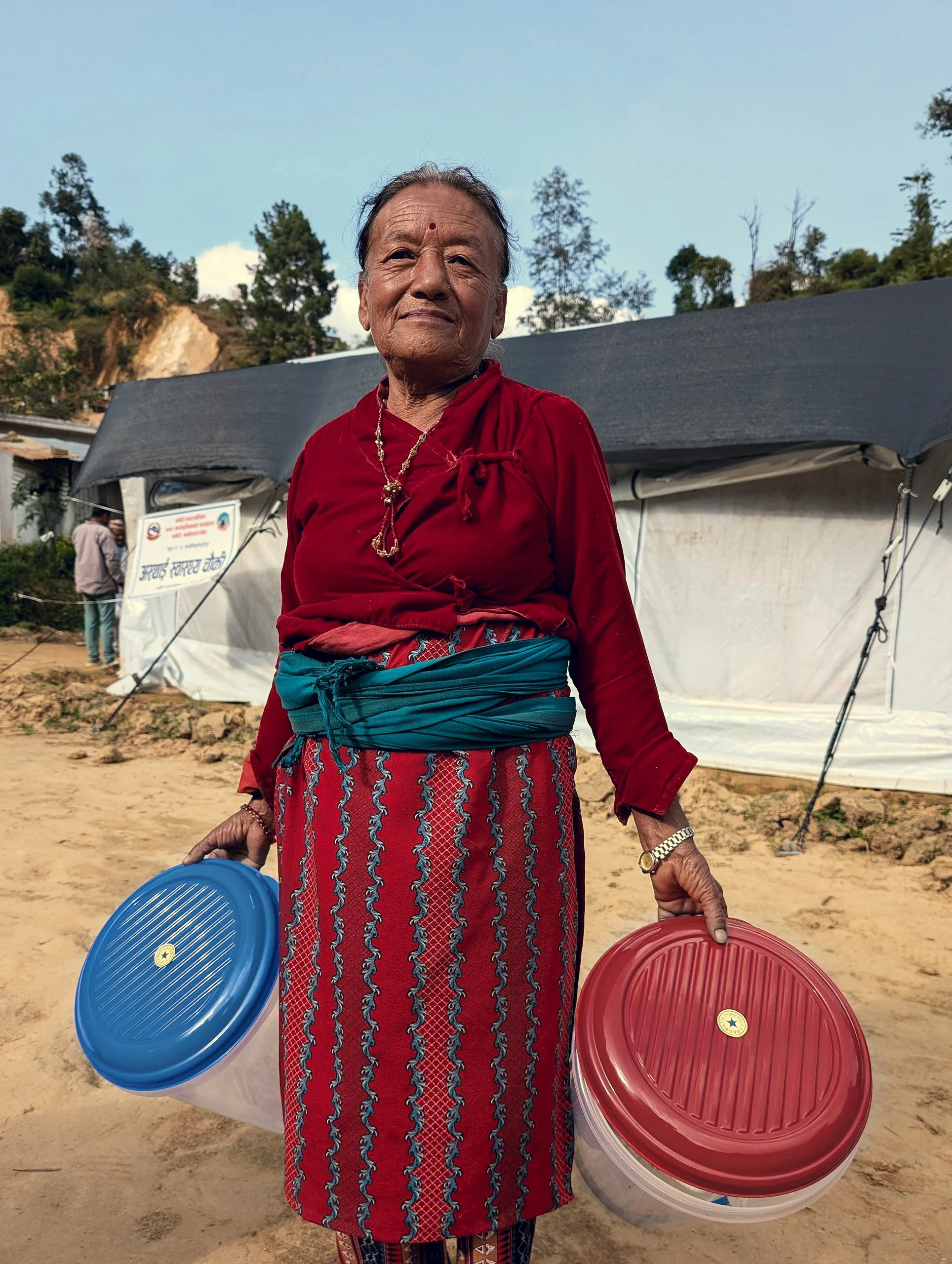 MightyWater_Nepal2024_WomanWithFilterSystem_RobMiller.jpg