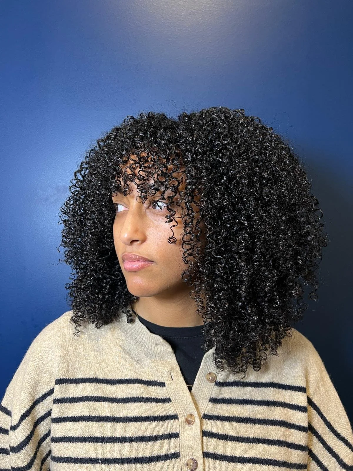 Définition de boucle d'une cliente au salon BYG PARIS.