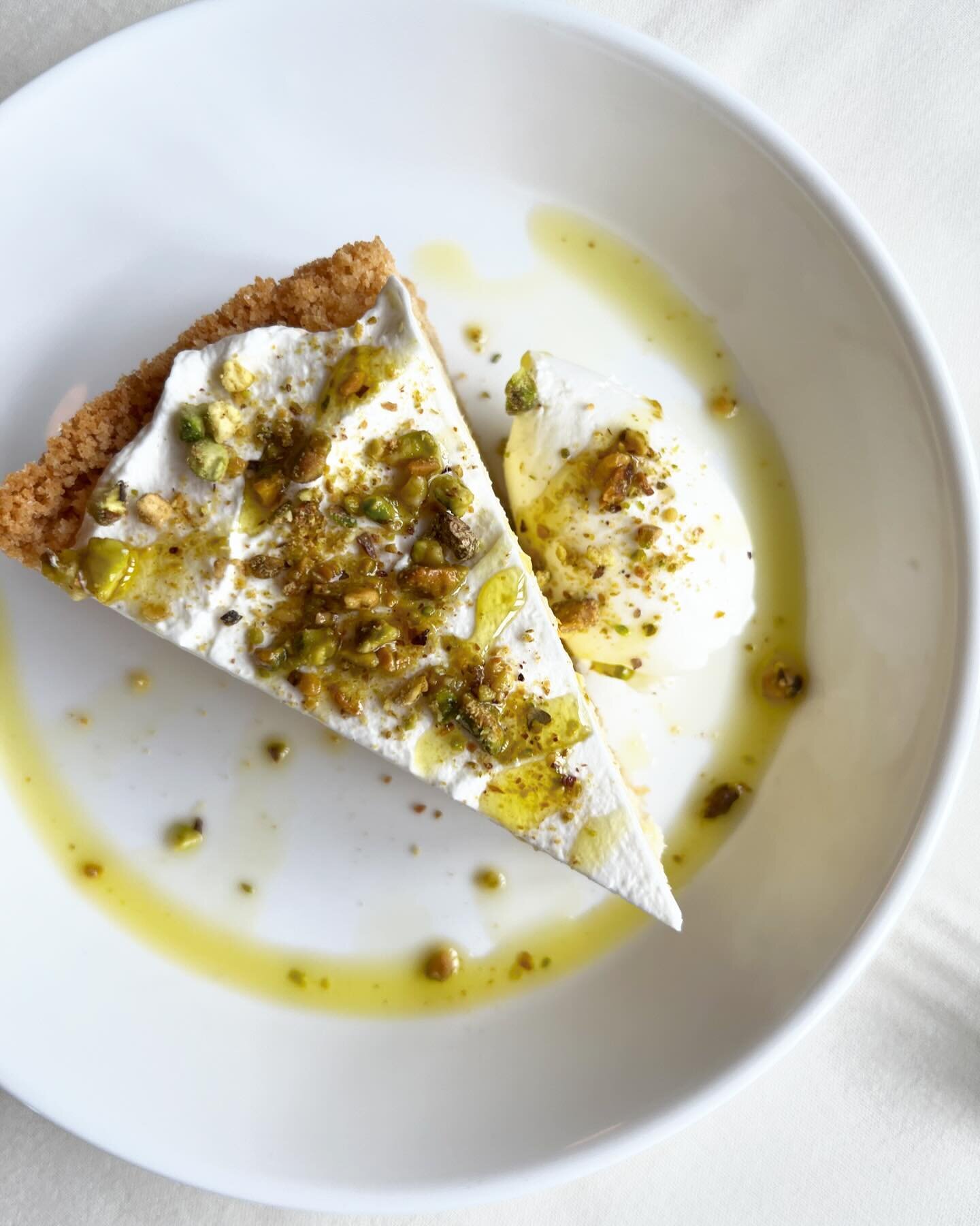 A perfect, fluffy lemon ricotta cheesecake (a crust of crushed ladyfingers!) with whipped mascarpone and toasted pistachios and drizzled with good olive oil. New to the menu! And ideal for a cozy rainy Monday in spring ☔️