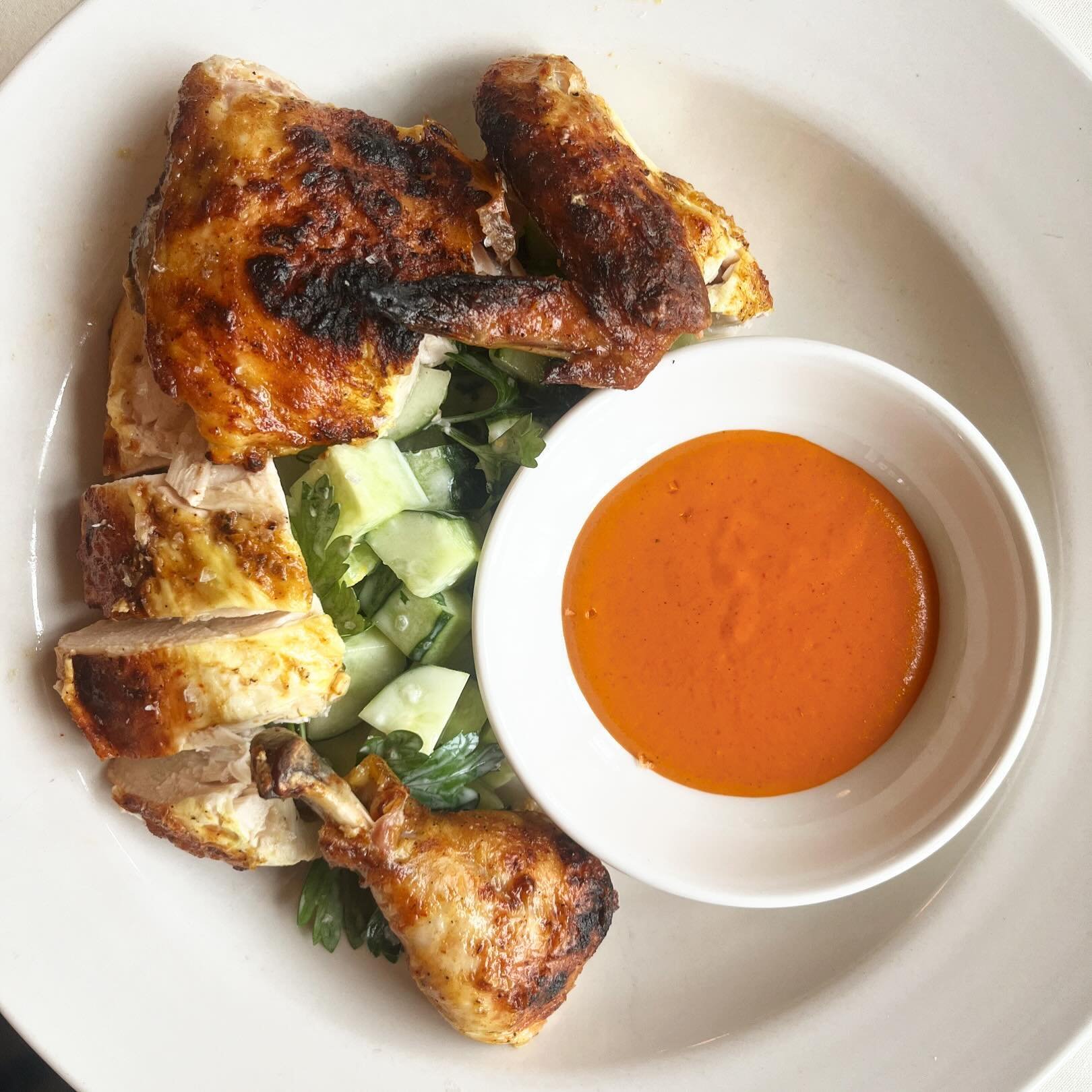 We&rsquo;ve got a newwwww half chicken in the house at Mish Mish and it&rsquo;s sosososo good bc it&rsquo;s brined in buttermilk and Moroccan spices, grilled over charcoal, and served with a simple herby cucumber salad. Hot sauce on the side for a ki