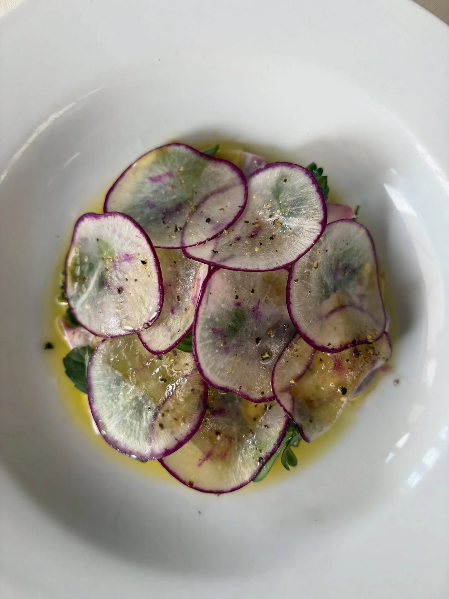 A little refreshing salad of chilled poached purple radishes tossed in champagne vin with marinated celtuce and herbs🧞
