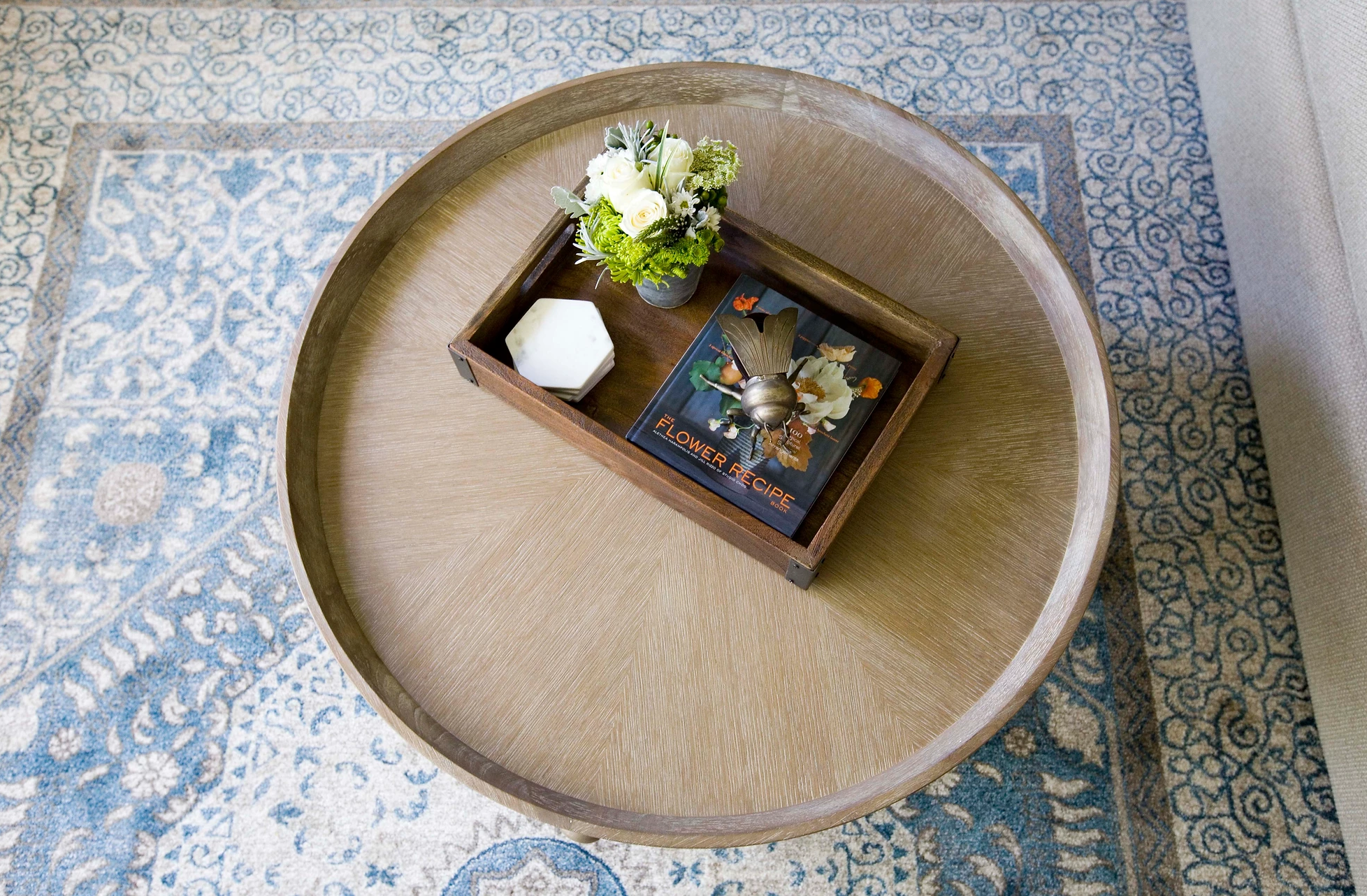 round-coffee-table-blue-rug.png