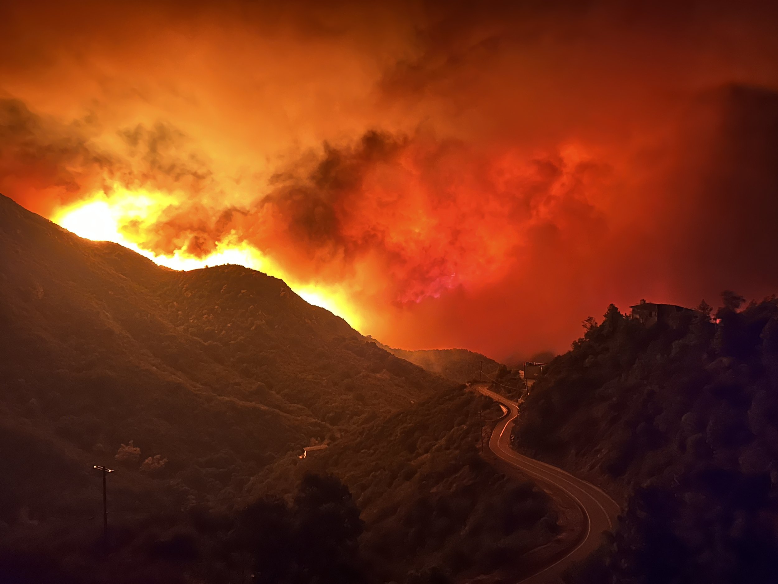 The Palisades Fire coming down Las Flores Canyon headed to the ocean at 11:33pm on January 7, 2025. When the community brigade was evacuating people in this neighborhood late in the night this is what they saw advancing towards them. 

 Photo Credit: