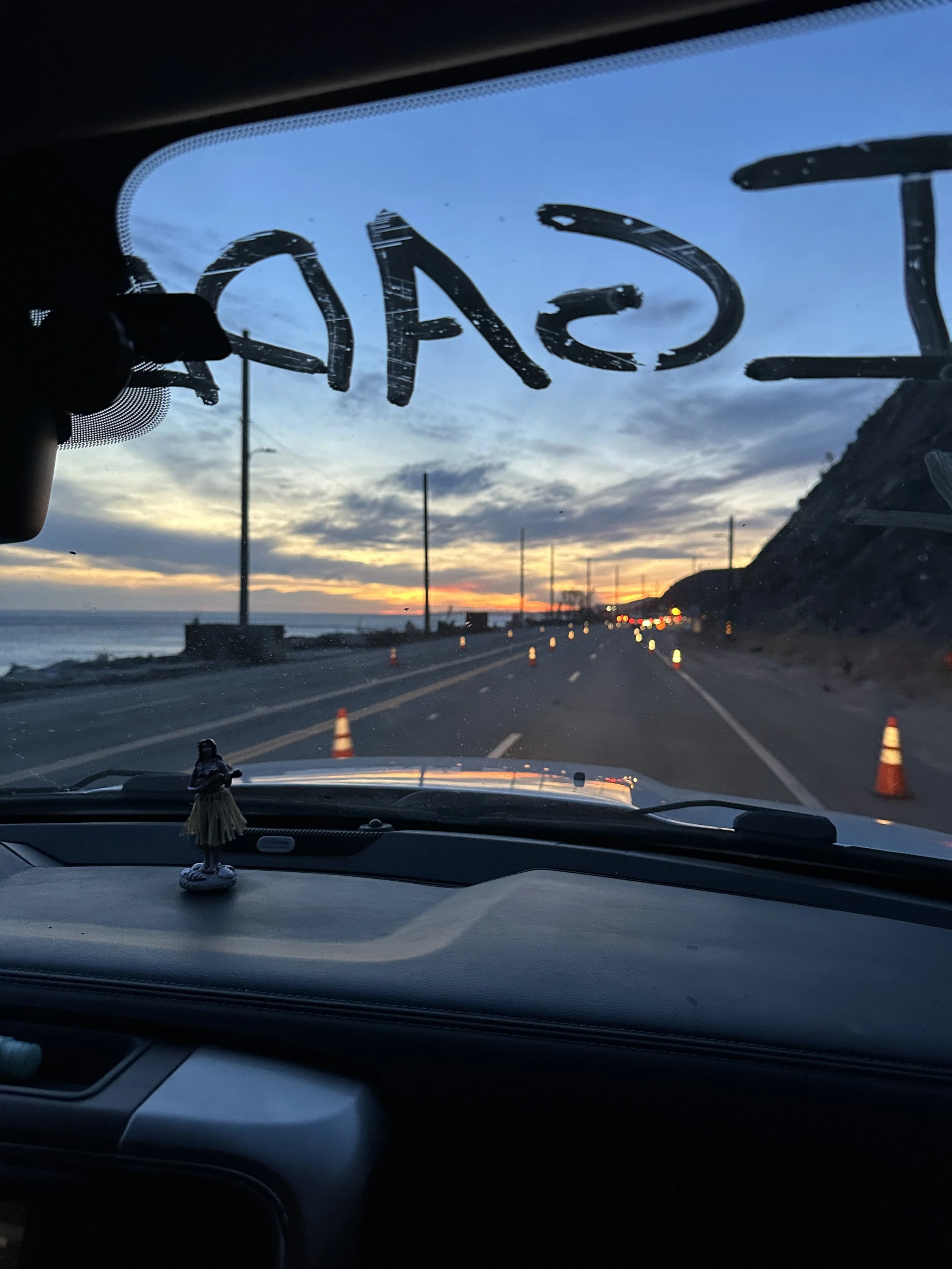 Bobble headed Hawaiian dancer on the dash of Keegan Gibb’s truck, pulling up to a roadblock.  Photo credit: Adriana Cargill