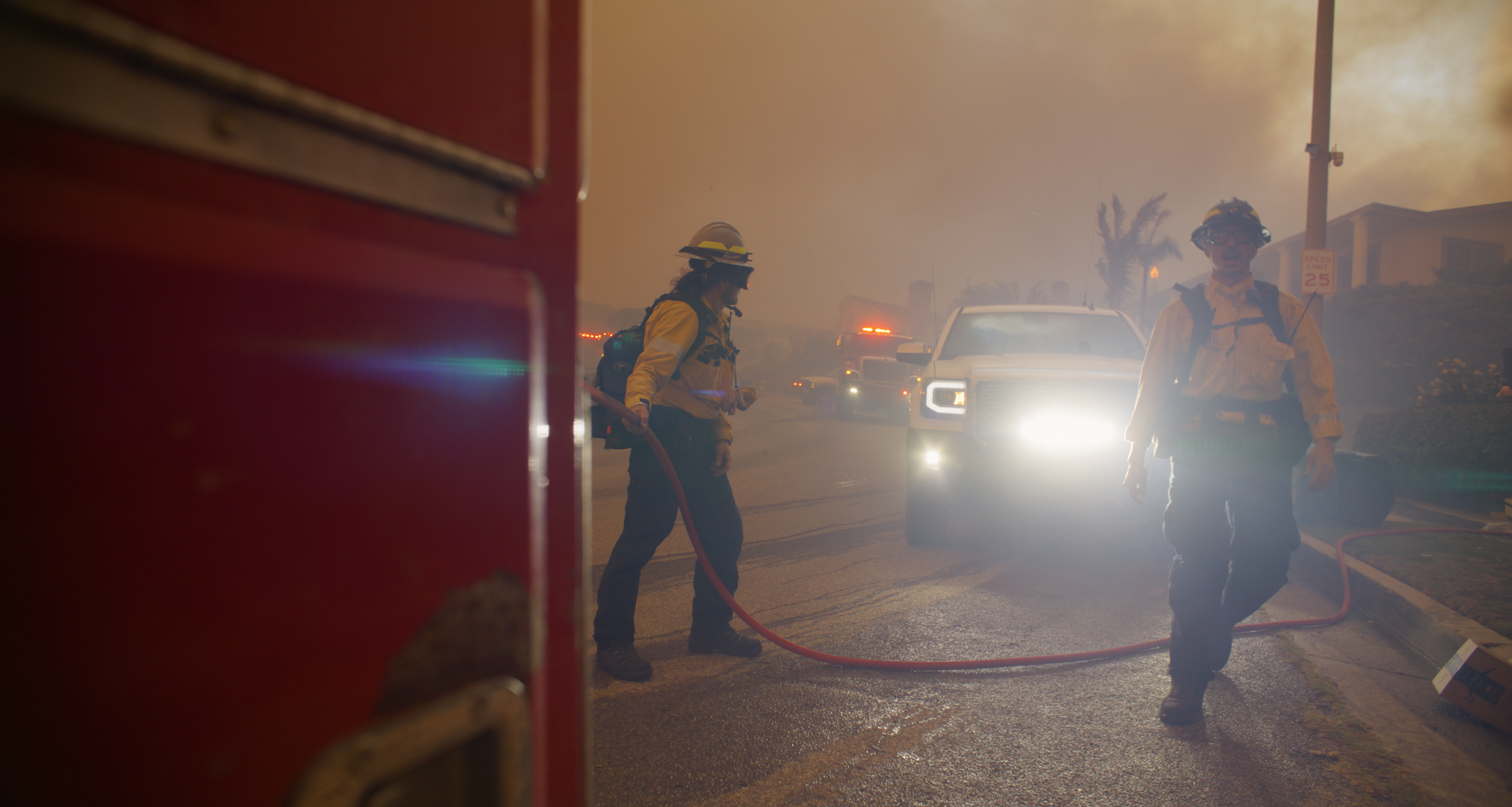 Aron Marderosian (left) and Keegan Gibbs (right) during the early hours of the Palisades Fire. 

 Photo Credit: Connor Nelsen