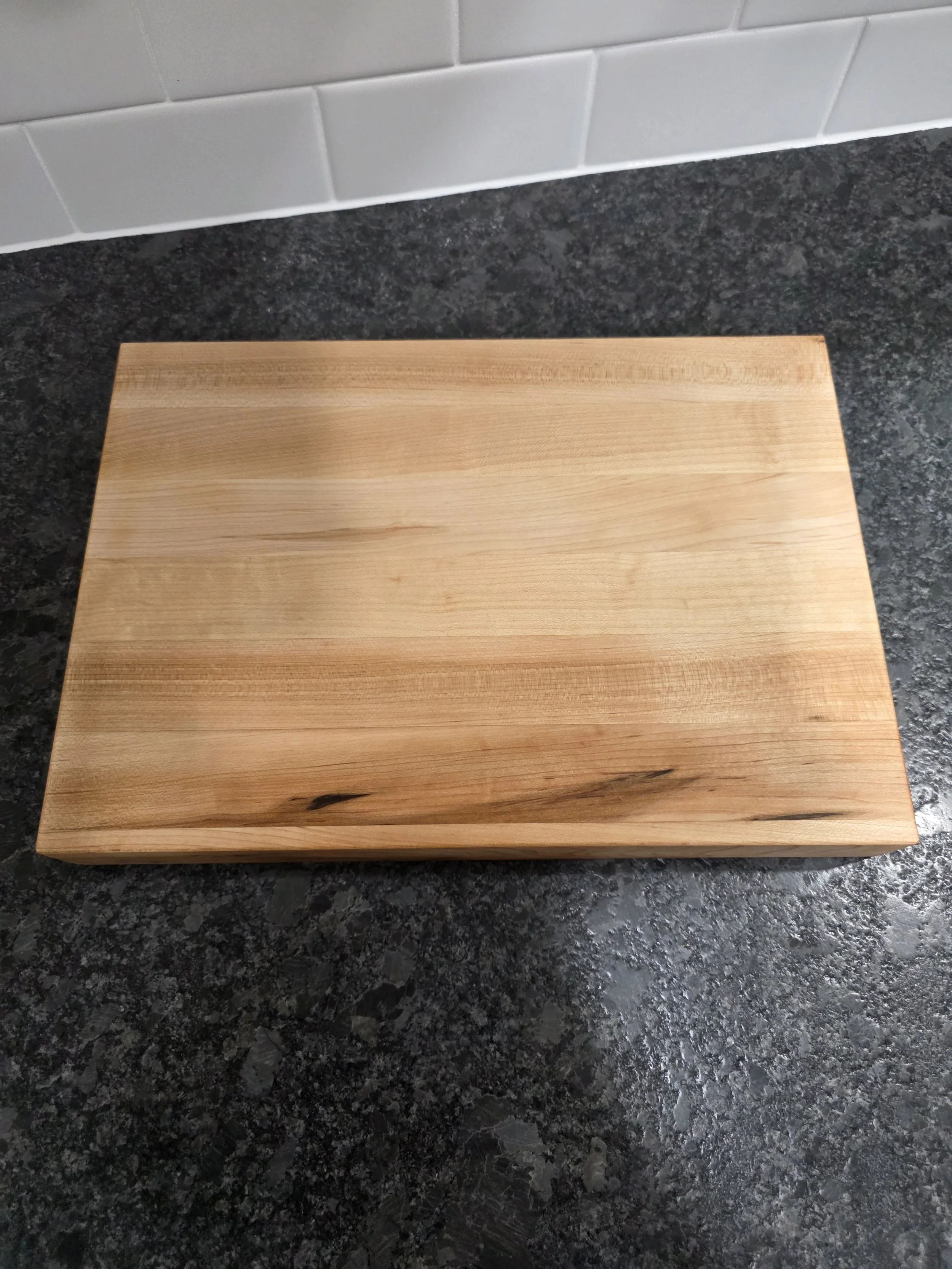 Solid maple cutting board birds eye view.