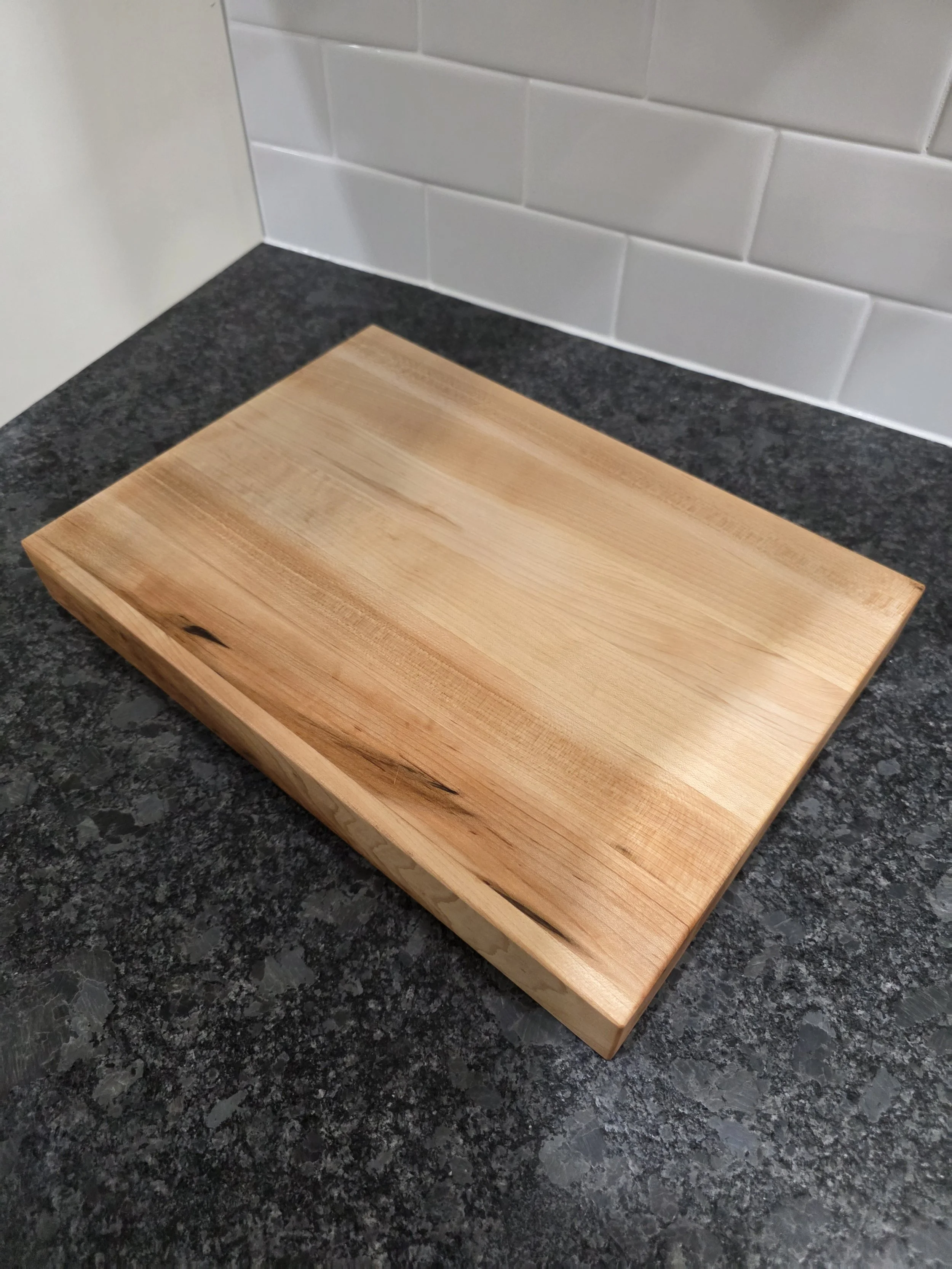 Thick hard maple edge grain cutting board full board.