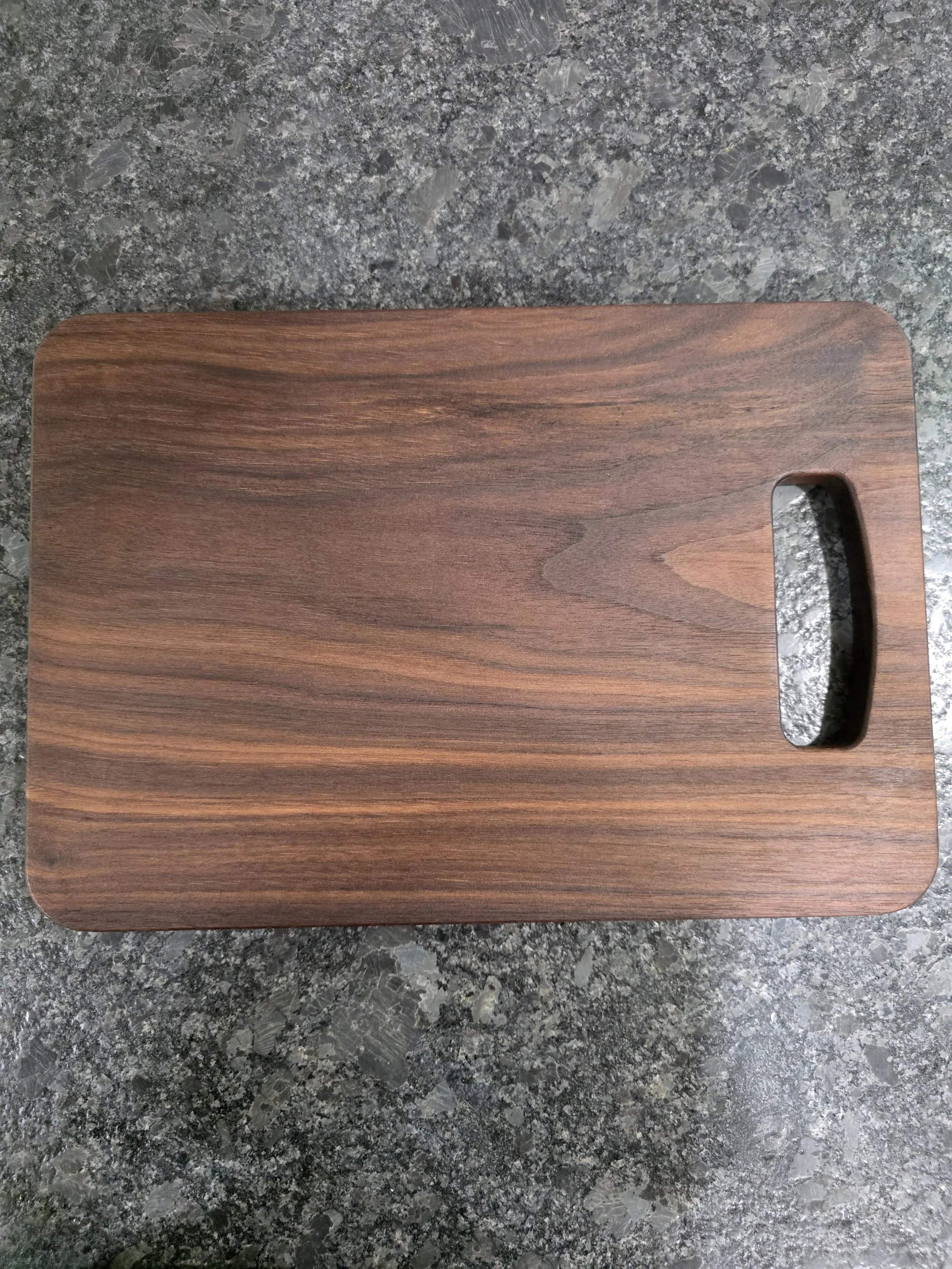 American black walnut classic cutting board on counter.