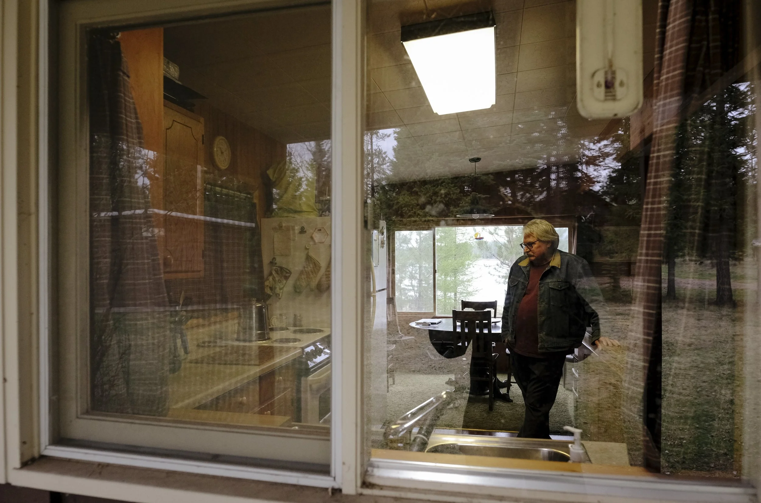 Dennis Clark boils water that was pumped directly from a pipe coming out of Seeley Lake on May, 4. Clark has been drinking boiled lake water ever since he started spending time in his cabin.