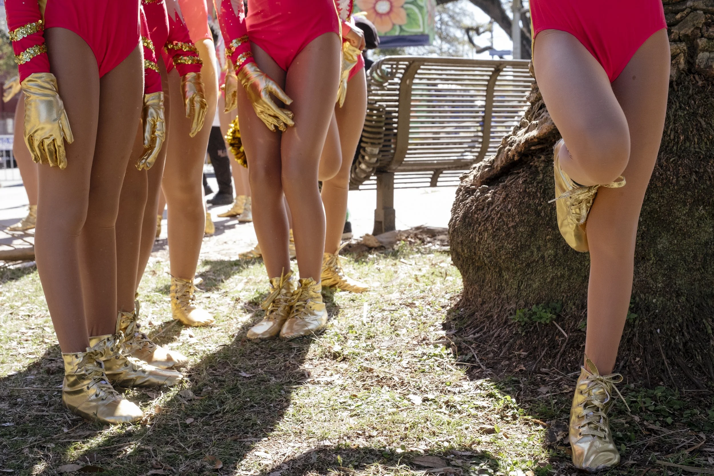 Members of the N.O.E Satin Dolls School of Dance wait around before dancing in the Mardi Gras Femme Fatale parade on February 8, 2026.  N.O.E Satin Dolls Performance Arts School of Dance is a non profit that was founded to create a welcoming and empo