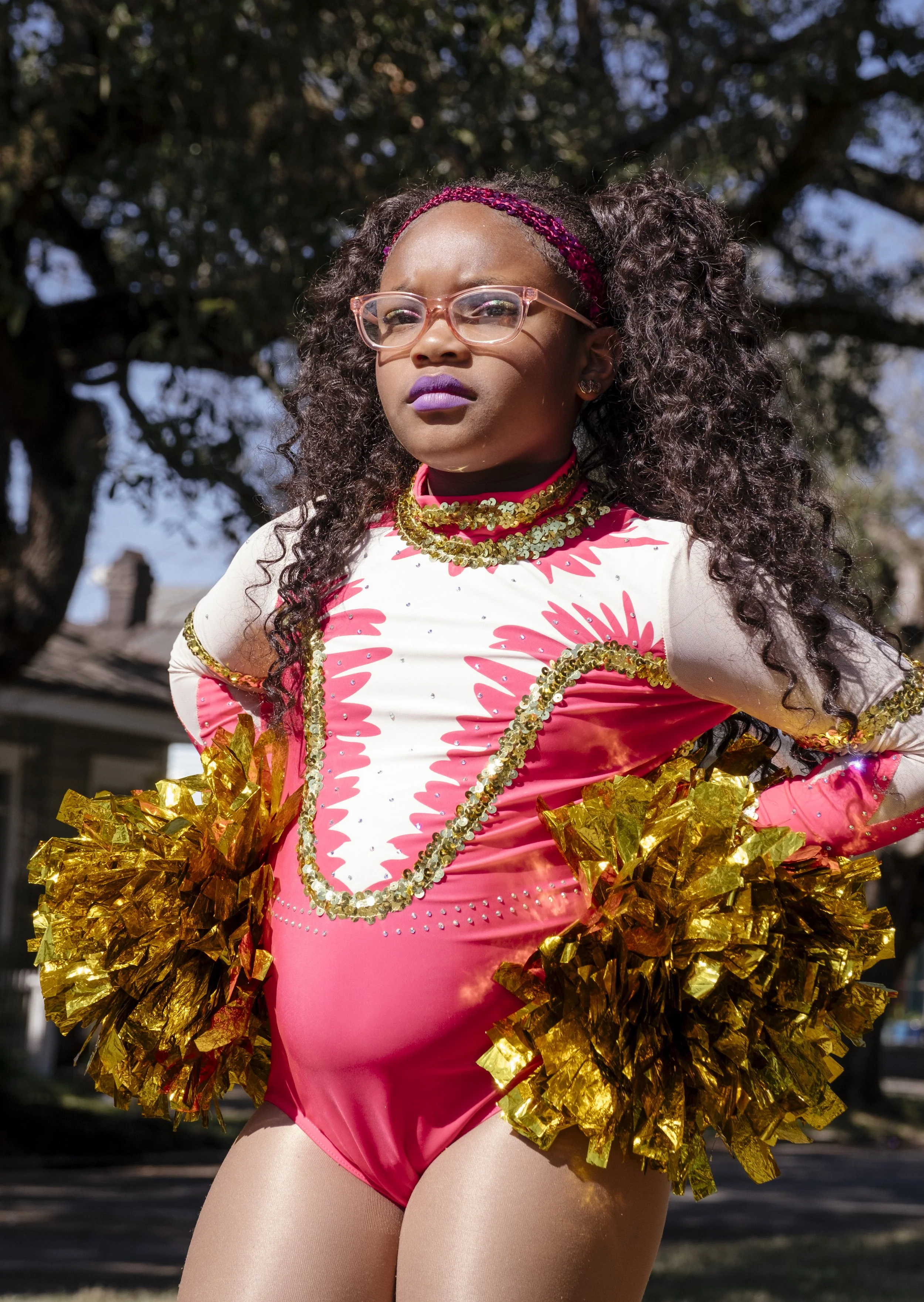 Monae, 8, is the youngest dancer performing for the N.O.E Satin Dolls dance in the Mardi Gras Mystic Krewe of Femme Fatale parade in New Orleans, Louisiana on February 8, 2026.  Monae has been dancing for 3 years with the Satin Dolls.