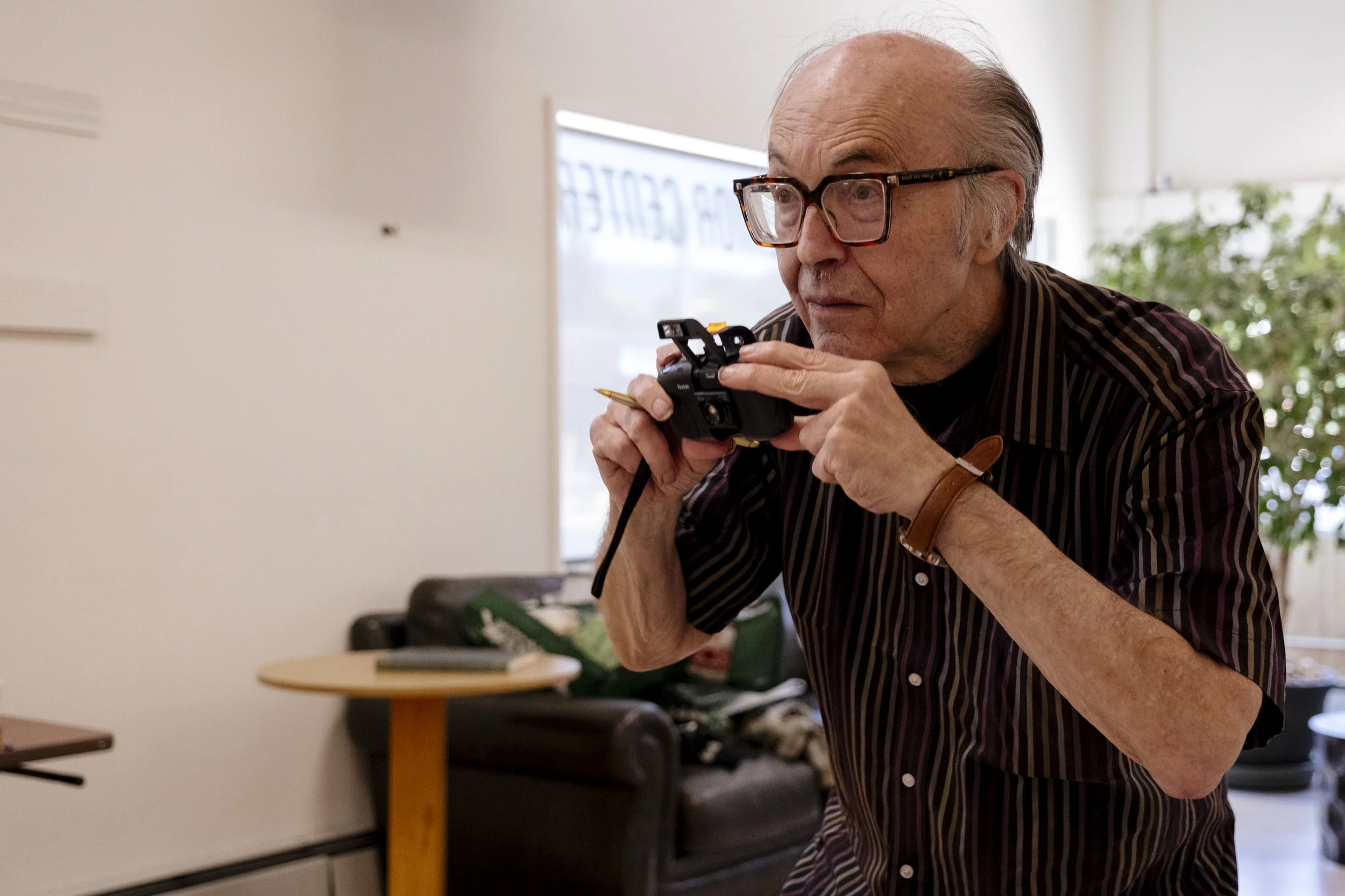 Nowak takes a photo of people playing chess at his tournament at the Missoula Senior Center on May 5, 2026.  He slowly stopped going to compete at other tournaments around town because of how early they started.  So Nowak made sure to begin his tourn