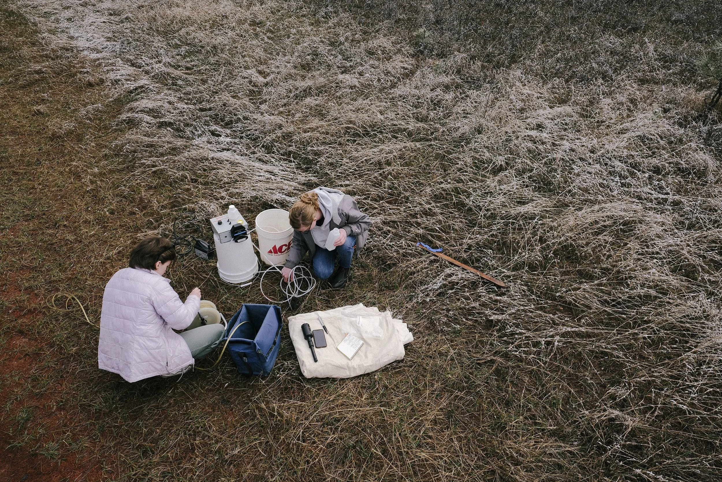 Rachel Suhs, an environmental health specialist, and Ellen Bedford with the MariCore, test the groundwater downtown Seeley Lake through a monitoring well on April, 22. The Missoula Public Health Center do quarterly testing on the 16 wells in town, l