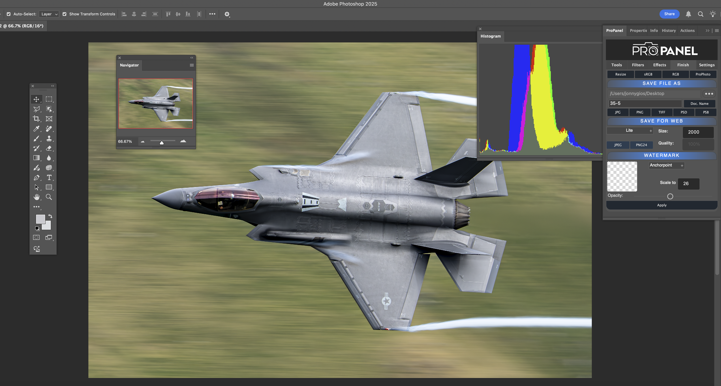 A photo of a fighter jet in mid-flight with a blurred background, viewed from above.