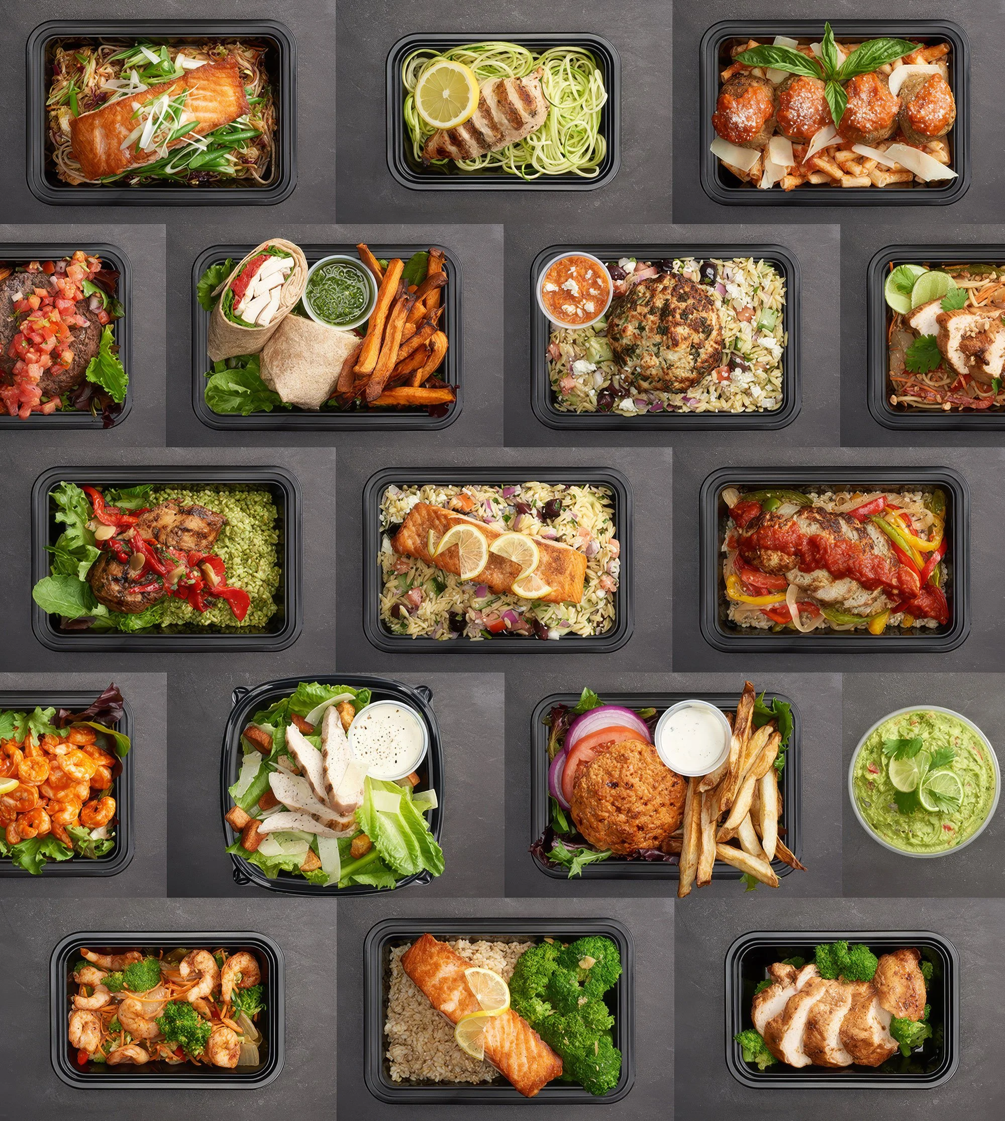 Eat Clean Bro meals presented in a cohesive overhead flat-lay. Consistent slate-gray backdrop and even studio lighting showcase the full menu in one appetizing image.