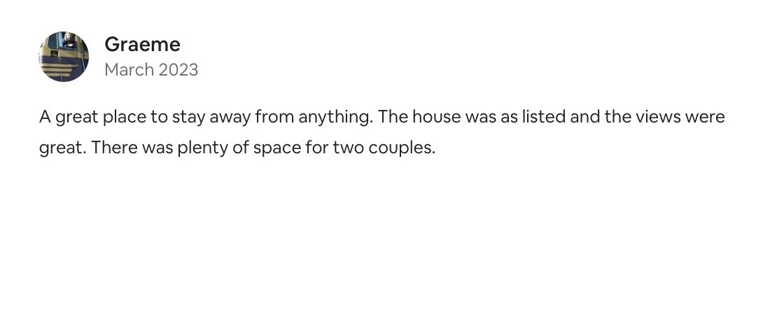 Screenshot of a text review about a house, mentioning the house was listed, had great views, and plenty of space for two couples.