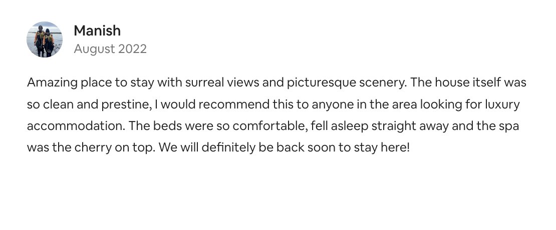 Screenshot of a review from a guest named Manish about a house stay in August 2022, praising the scenic views, clean and luxurious house, comfortable beds, and spa with cherry on top.