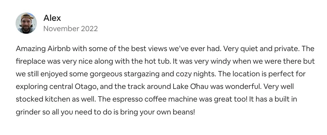 Screenshot of a written review by Alex from November 2022 describing a quiet Airbnb with a fireplace, hot tub, view of Lake Otago, and a well-stocked kitchen.