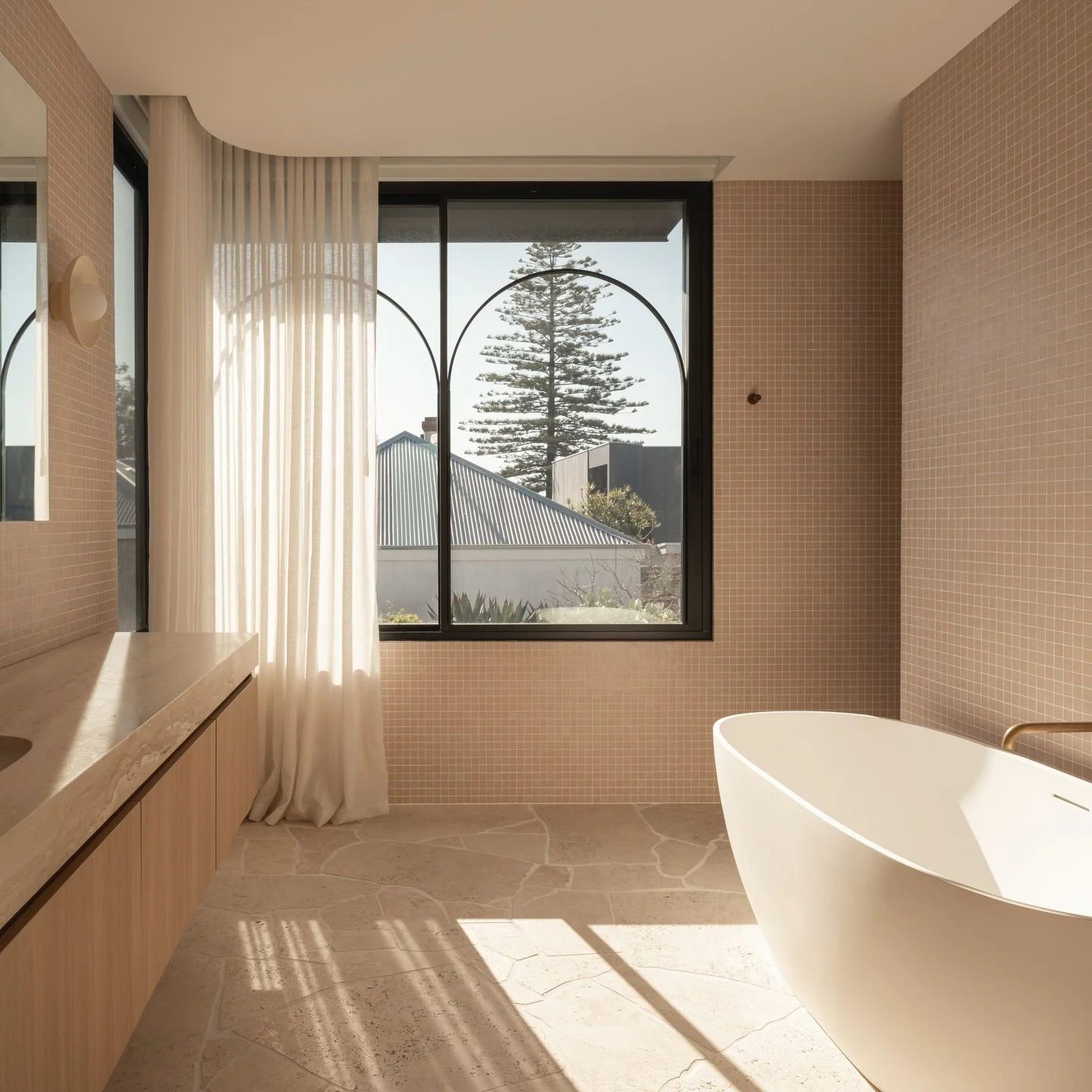 Who said curtains don&rsquo;t belong in the bathroom? 

Creating a quiet sense of calm, filtering daylight and adding an effortless, lived-in elegance.

A custom-bent track is neatly concealed within the recess, allowing the curtains to fall seamless