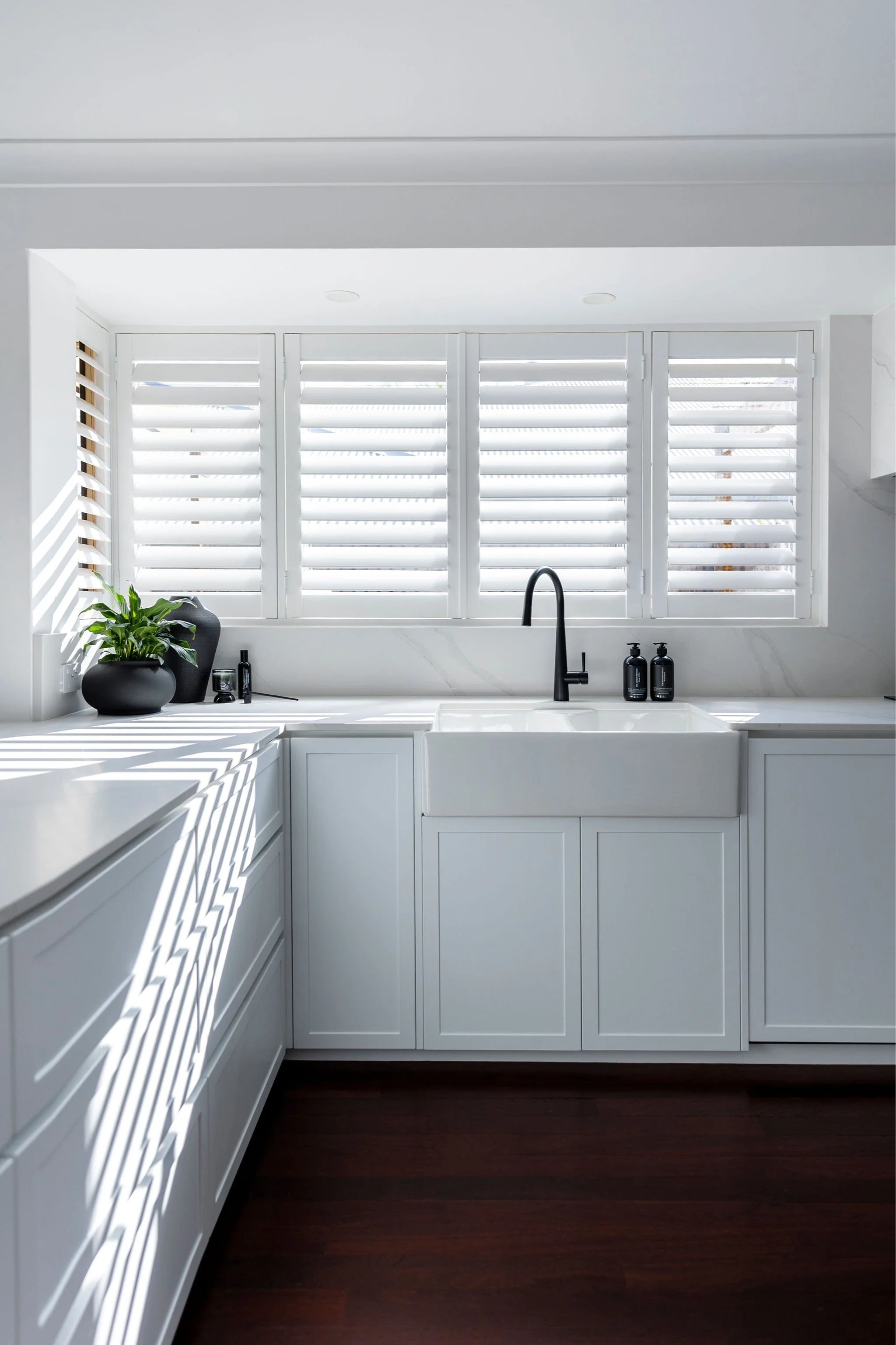 Shutters in shower area of modern bathroom