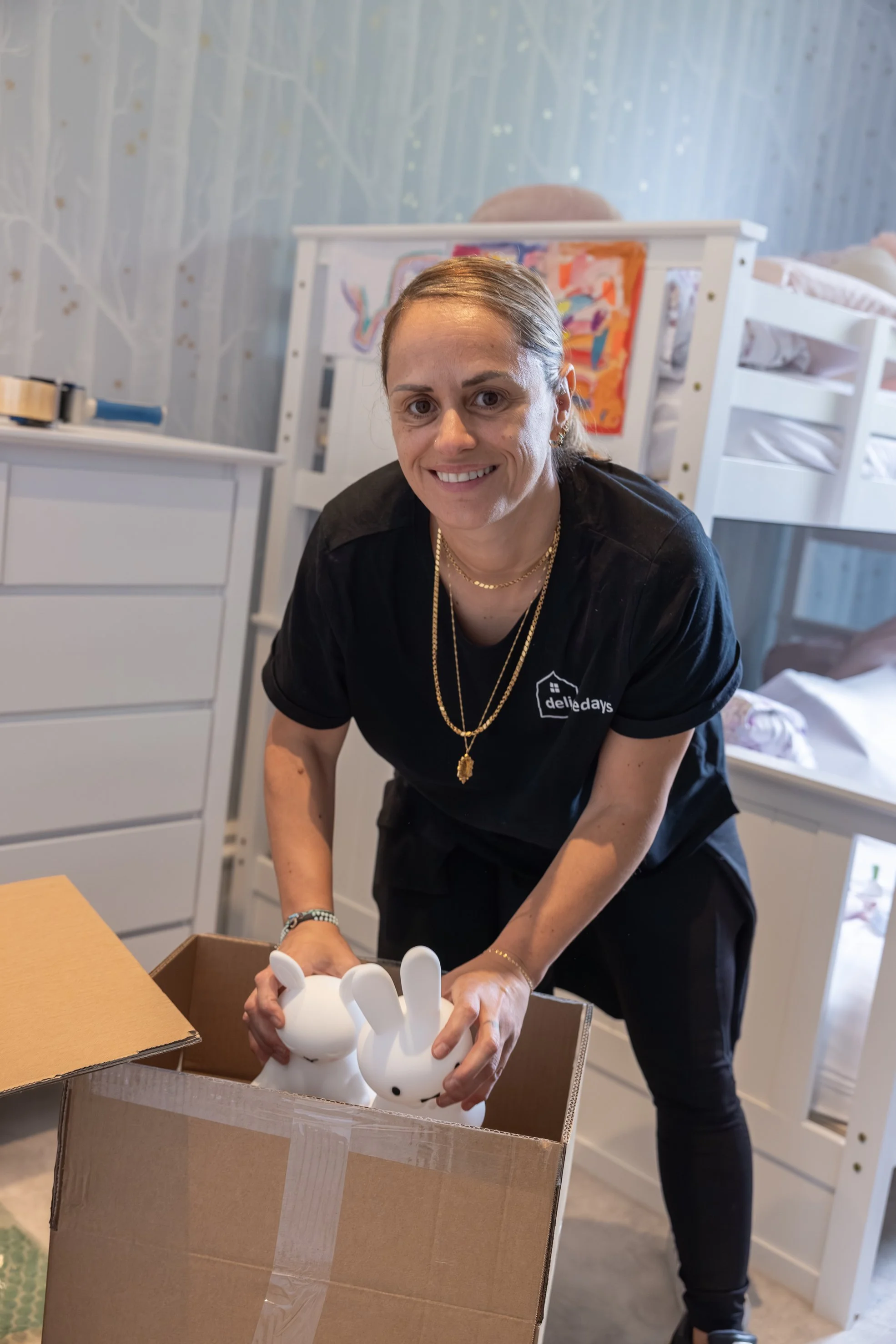 A woman packing kids toys