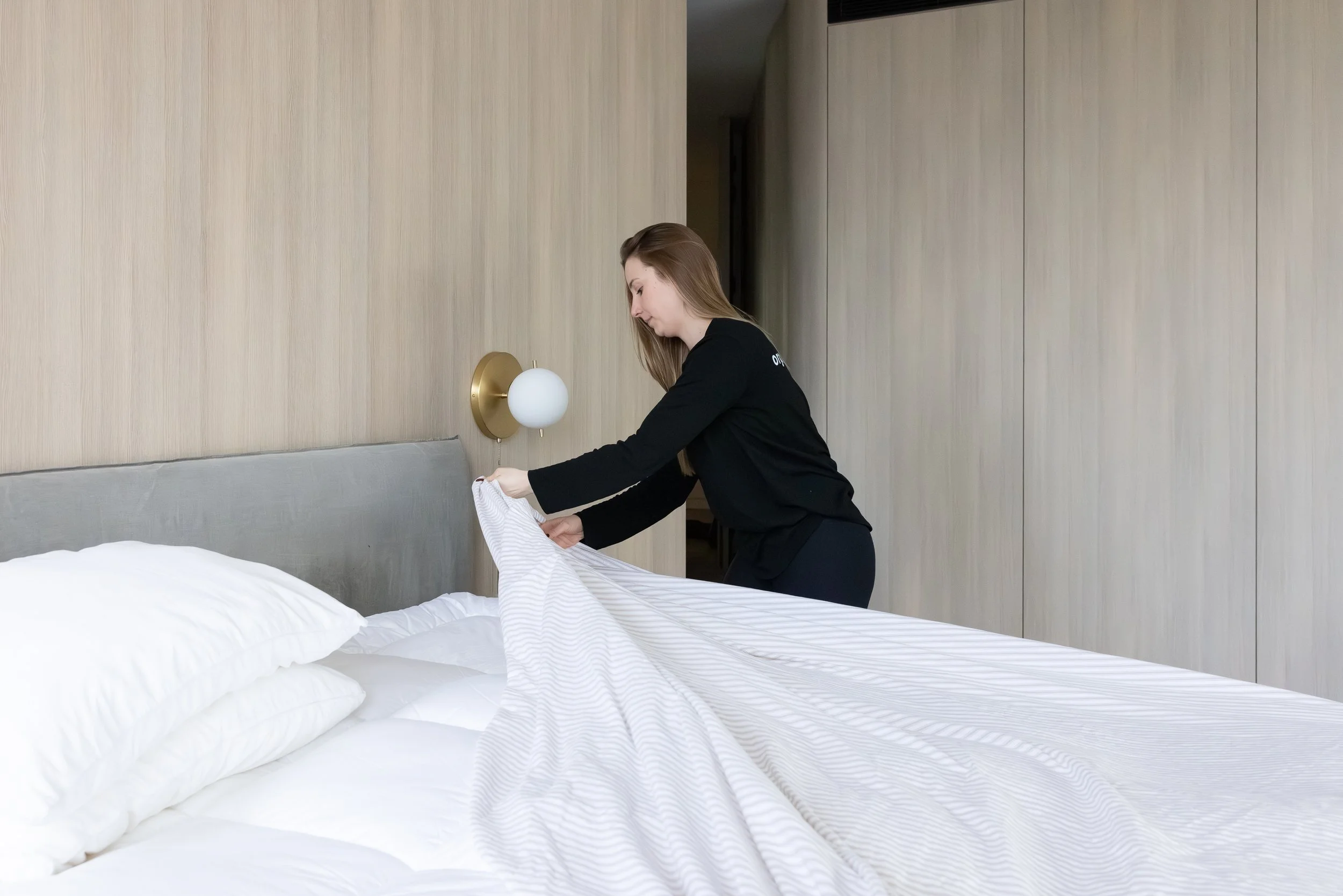 Woman making a bed