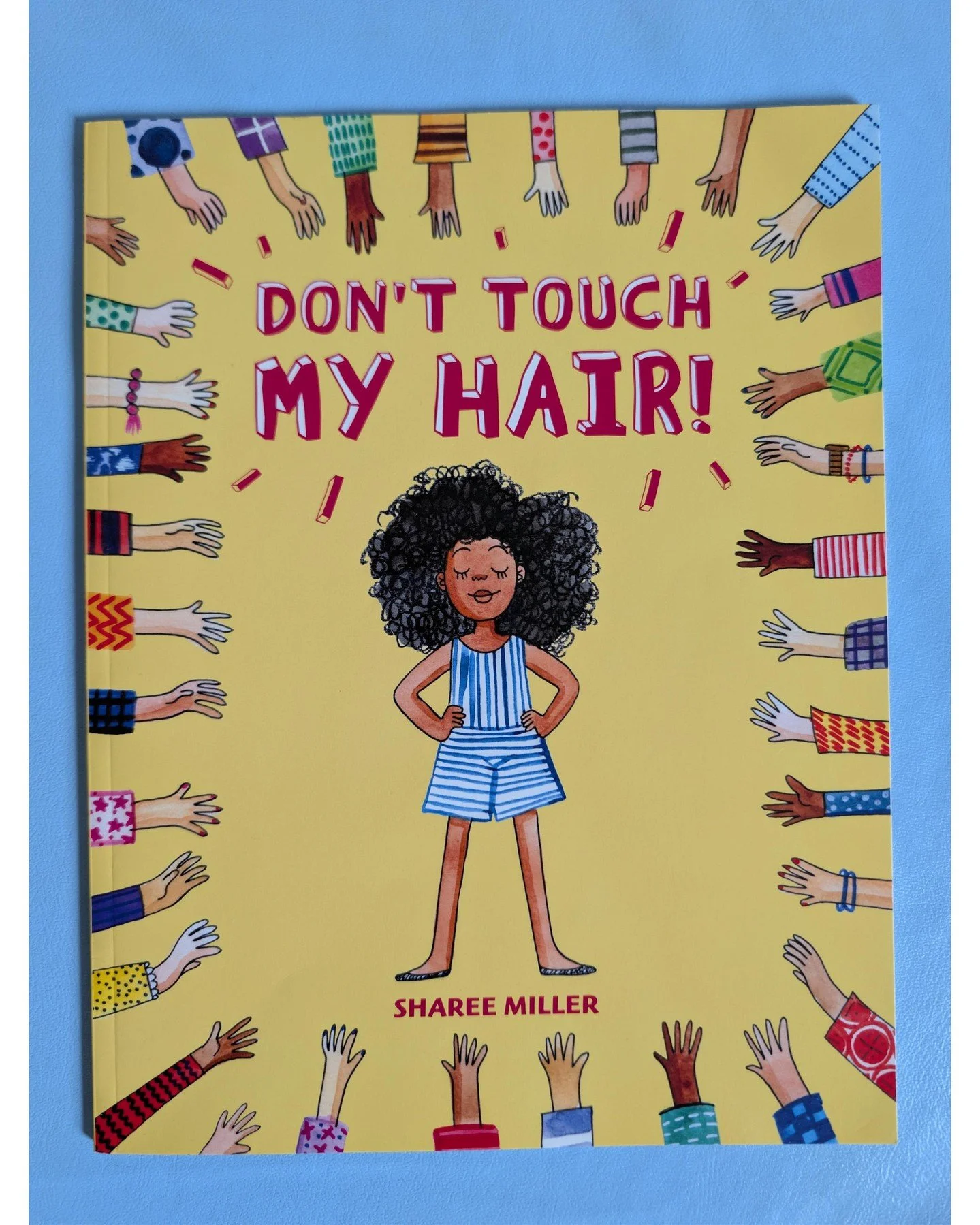 This week we're reading "Don't Touch My Hair" by Sharee Miller: 

This book tells the story of Aria, a confident girl who loves her hair (the kind of kid we're trying to cultivate here at Styles 4 Kidz). To avoid people touching her hair wi