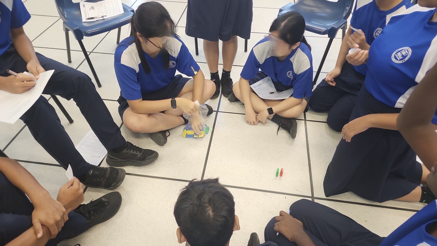 students discussing on a dominos activity