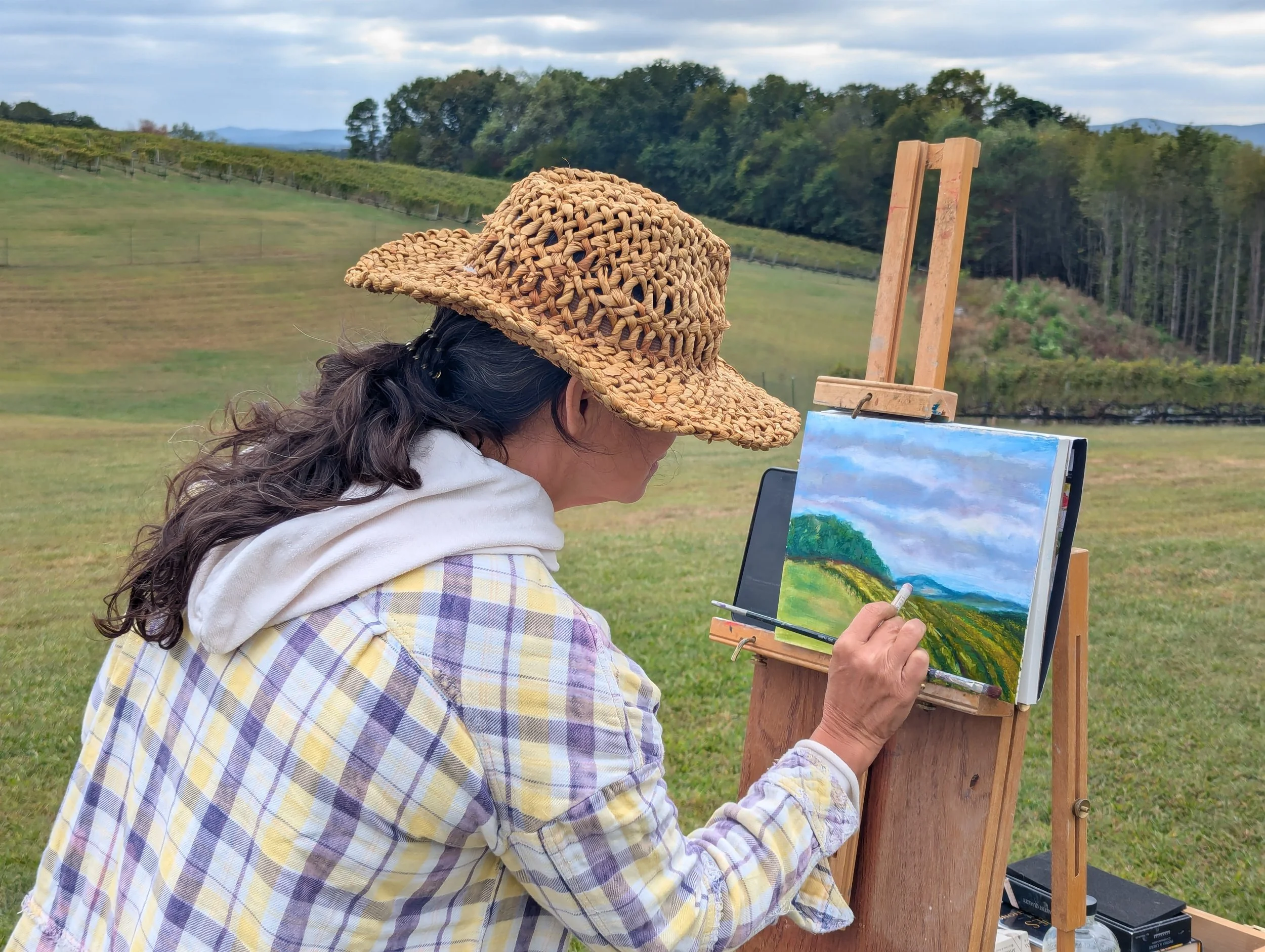 Cynthia Whalen painting at Dobbins Creek Vineyard.