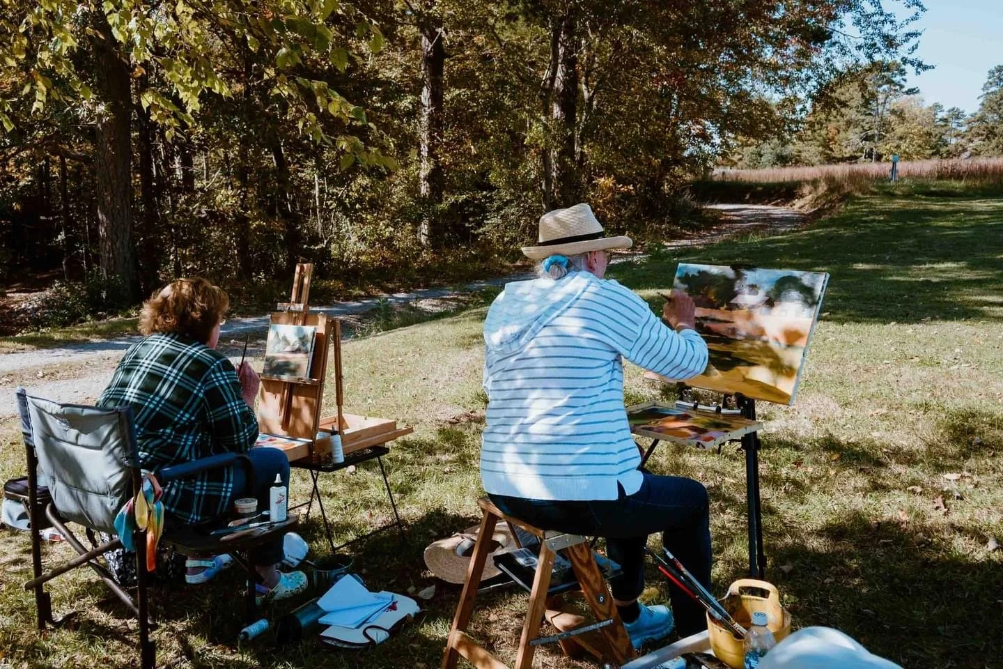 Artists painting during a quick paint competition.