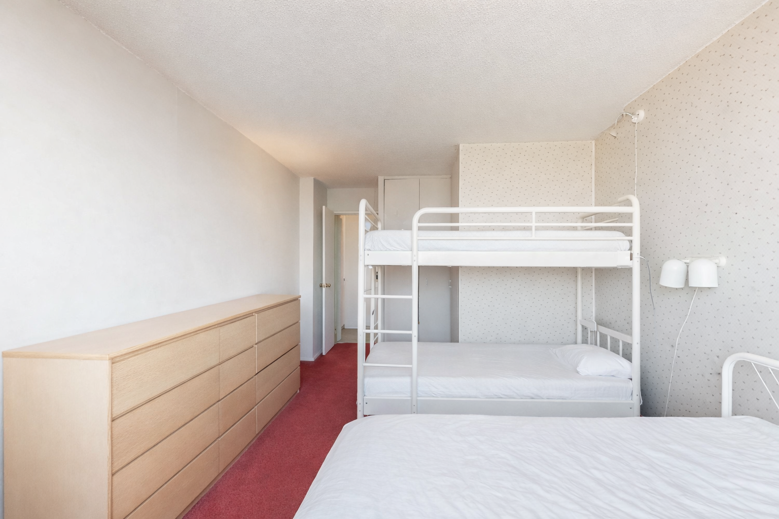 Bright and clean bedroom space.png