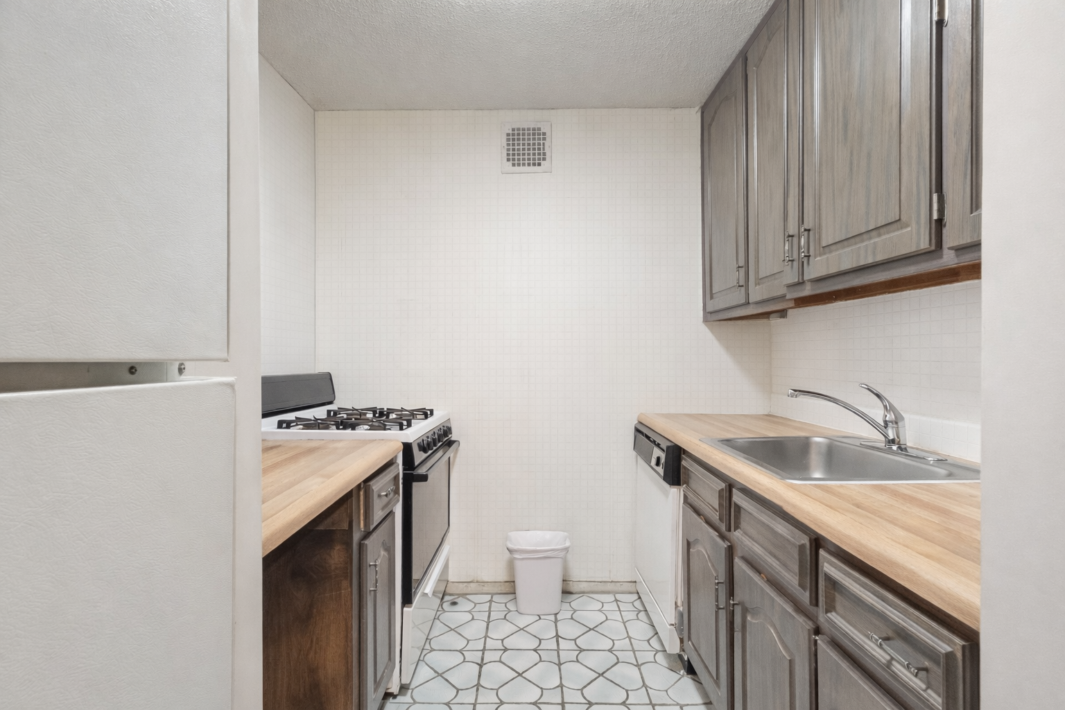 Modern kitchen with white appliances.png