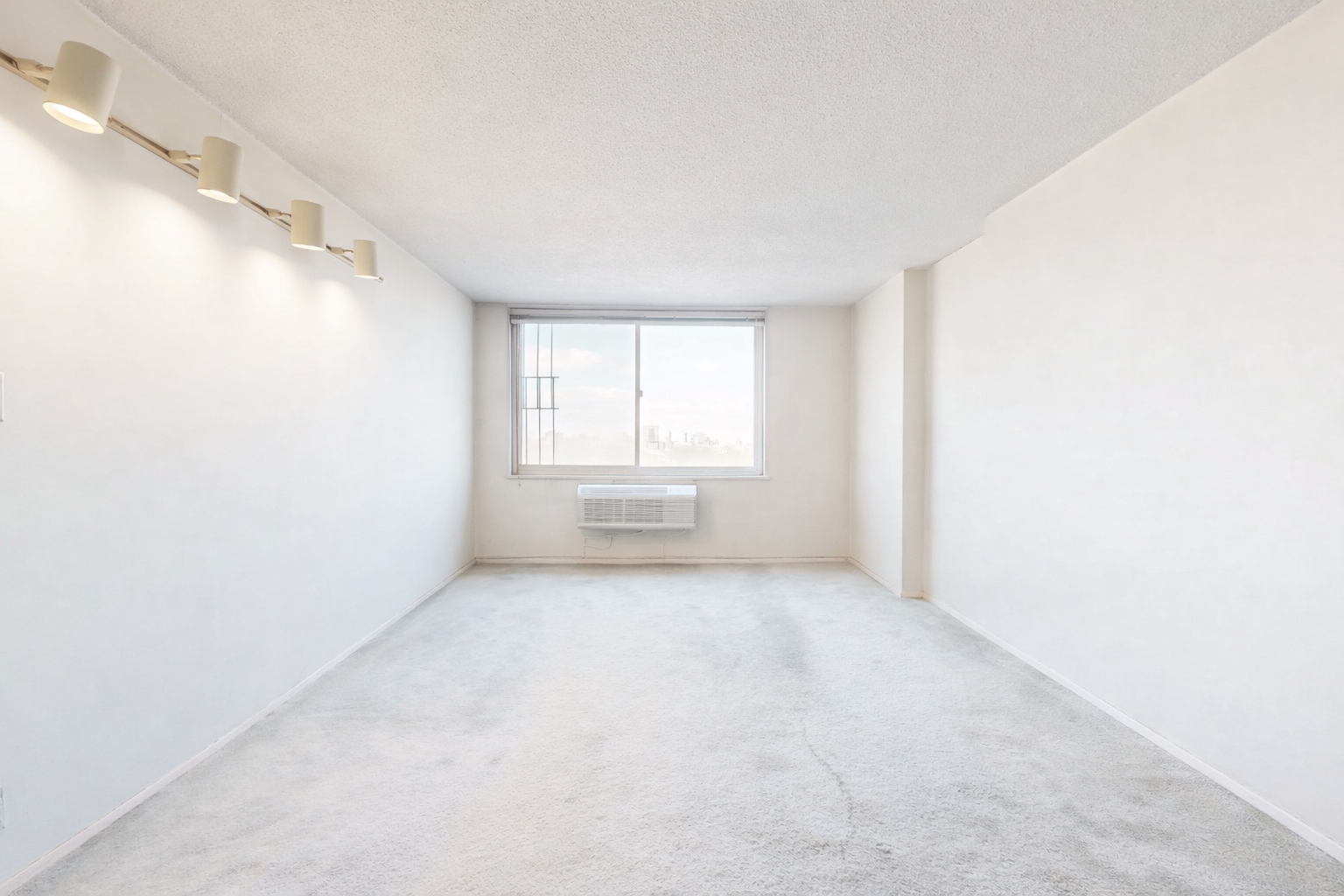 Empty modern living room with city view.png
