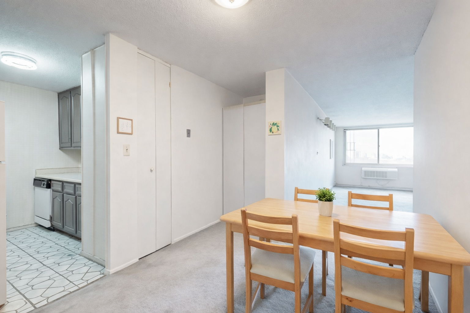 Modern dining area with open kitchen.png