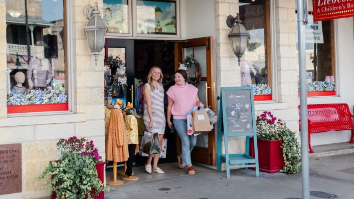 Two ladies shop at a Childrens Boutique on Main Street in Fredericksburg, Texas.